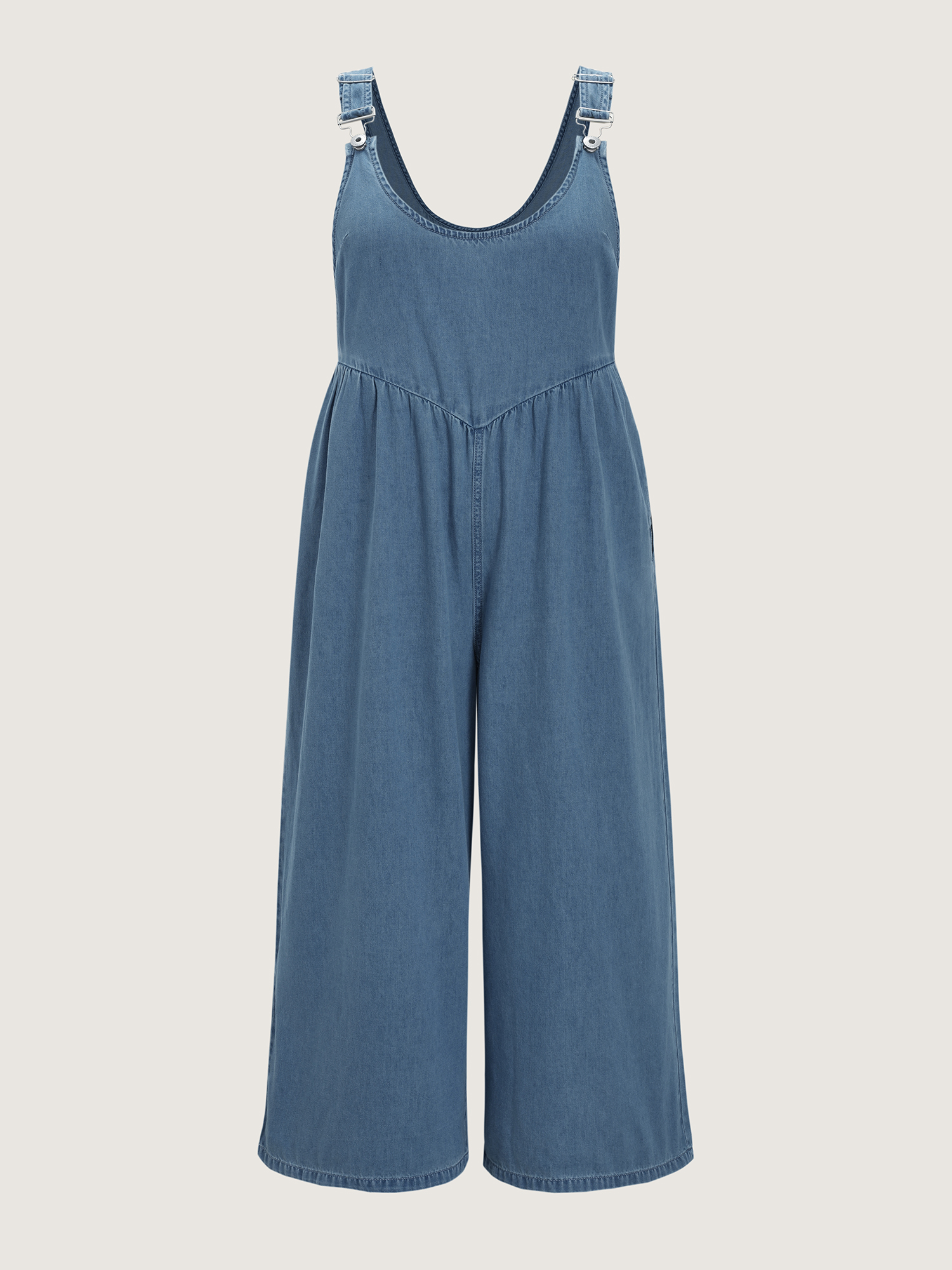 Side view of BloomChic Women's Plus Size Pleated Adjustable Overall Straps Denim Jumpsuit Denimlightblue Casual 10/M