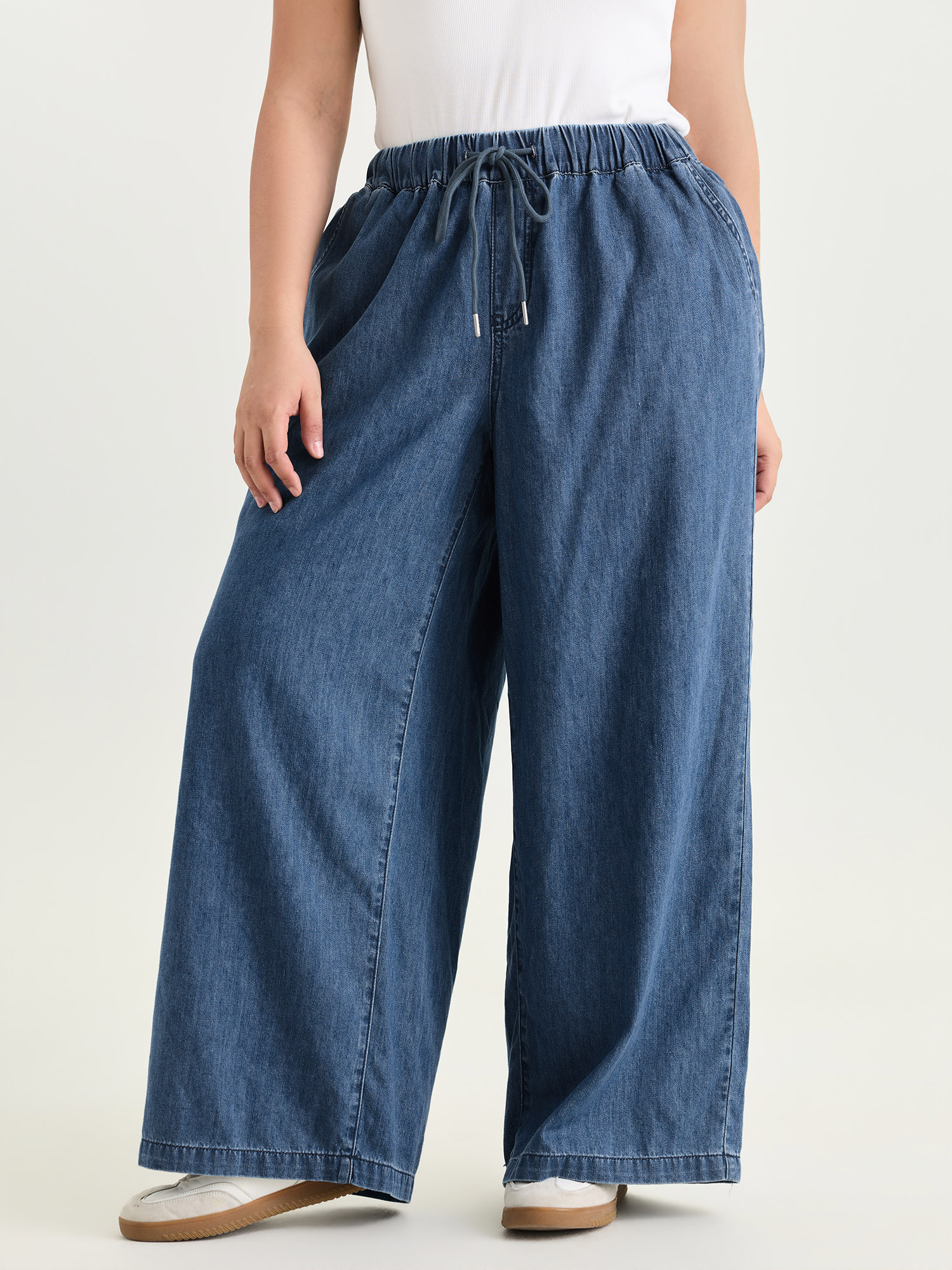 Side view of BloomChic Women's Plus Size Drawstring Waist Wide-Leg Pocket Jeans Midblue Wide leg No stretch 30/6X