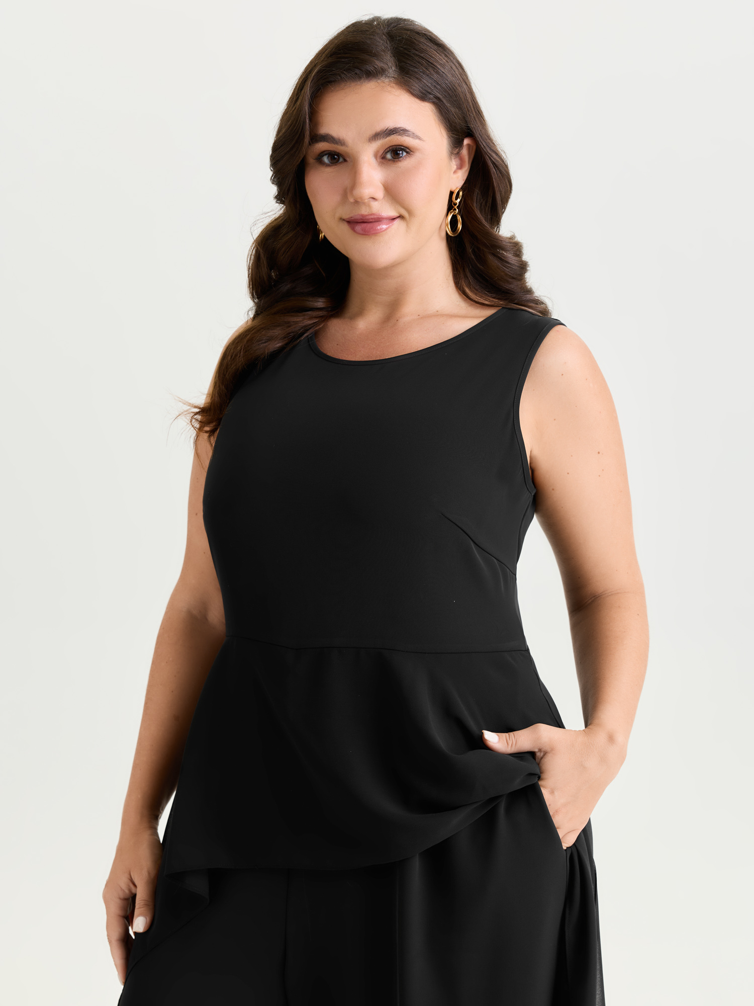 Side view of BloomChic Women's Plus Size Stretchy Sheer Layered Sleeveless Jumpsuit Black Elegant 30/6X