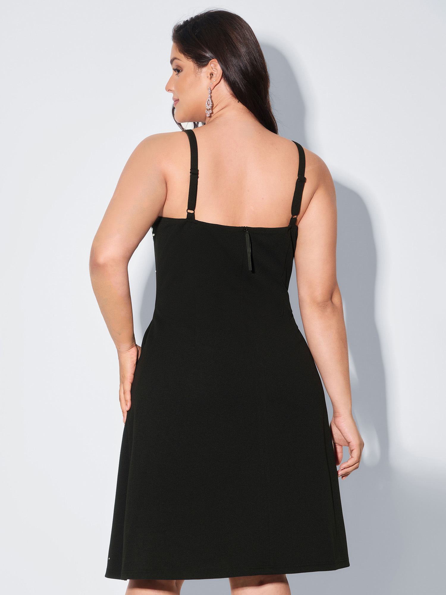 Side view of BloomChic Women's Plus Size Beaded Sleeveless Pocket Mini Dress Pureblack Party Midi Rhinestone detailing Square Neck 18-20/2X