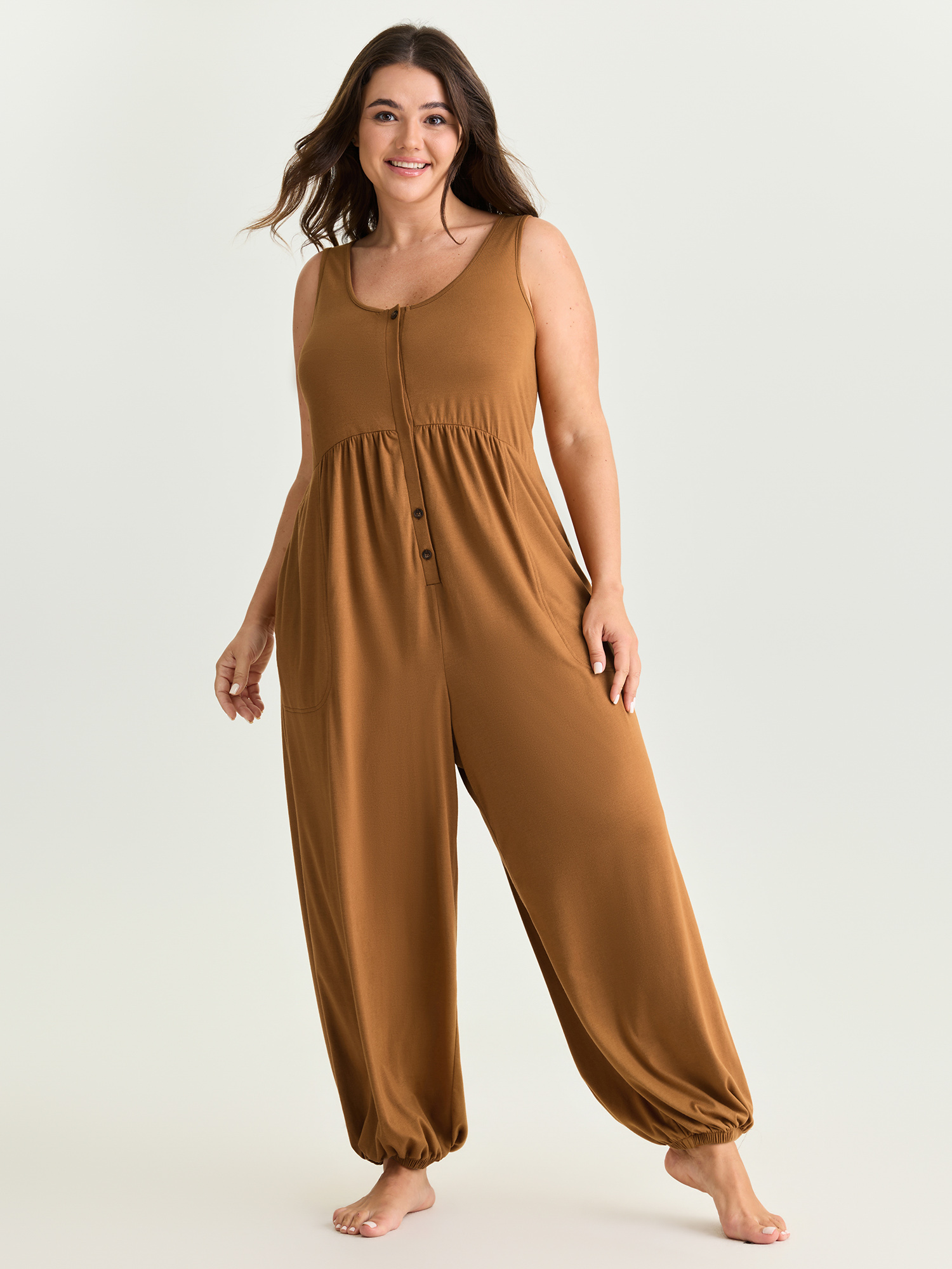 Side view of BloomChic Women's Plus Size Supersoft Buttons Pleated Cuffed Hem Lounge Jumpsuit Yellowishbrown not graphics 28/5X
