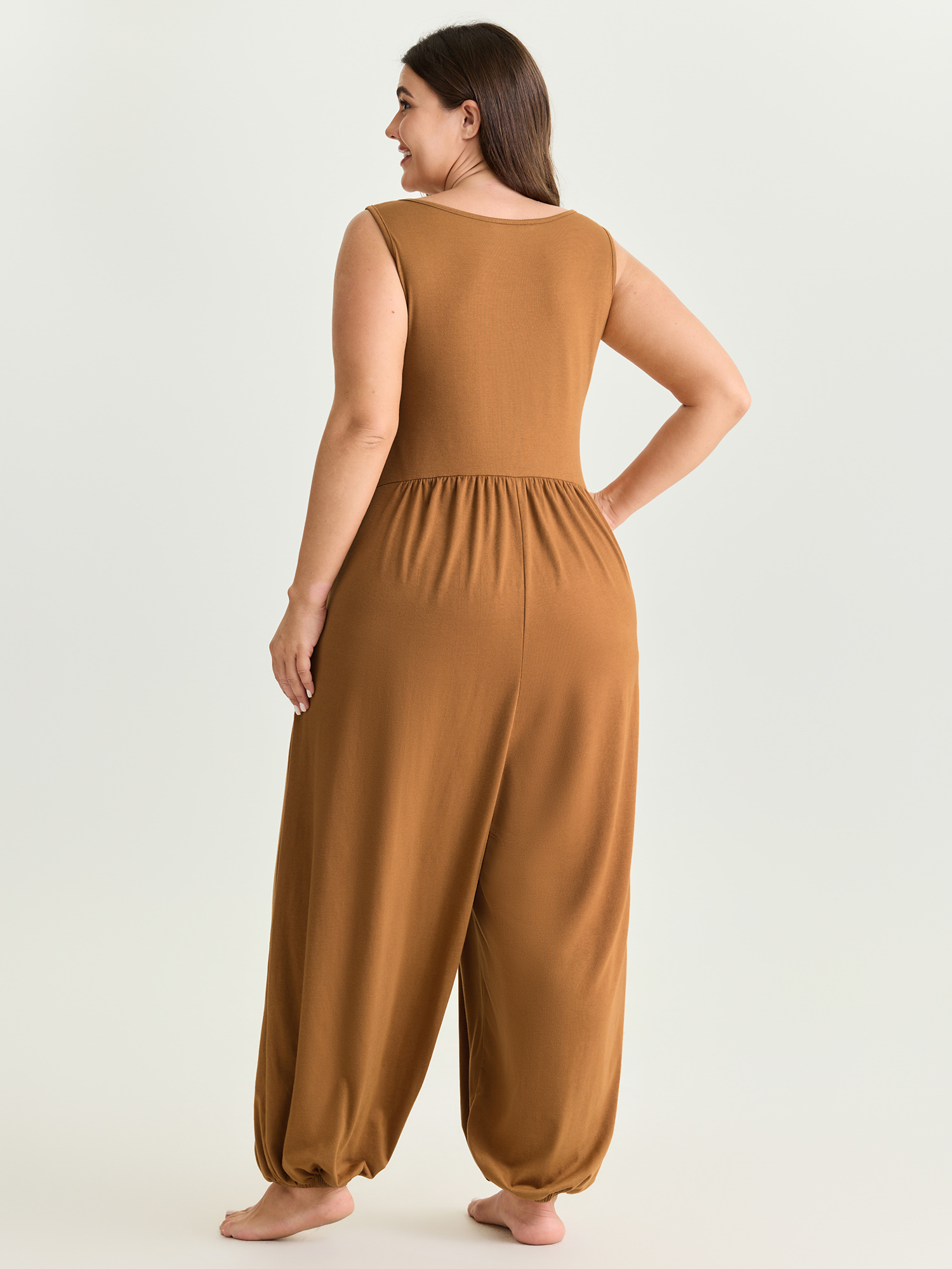 Side view of BloomChic Women's Plus Size Supersoft Buttons Pleated Cuffed Hem Lounge Jumpsuit Yellowishbrown not graphics 28/5X