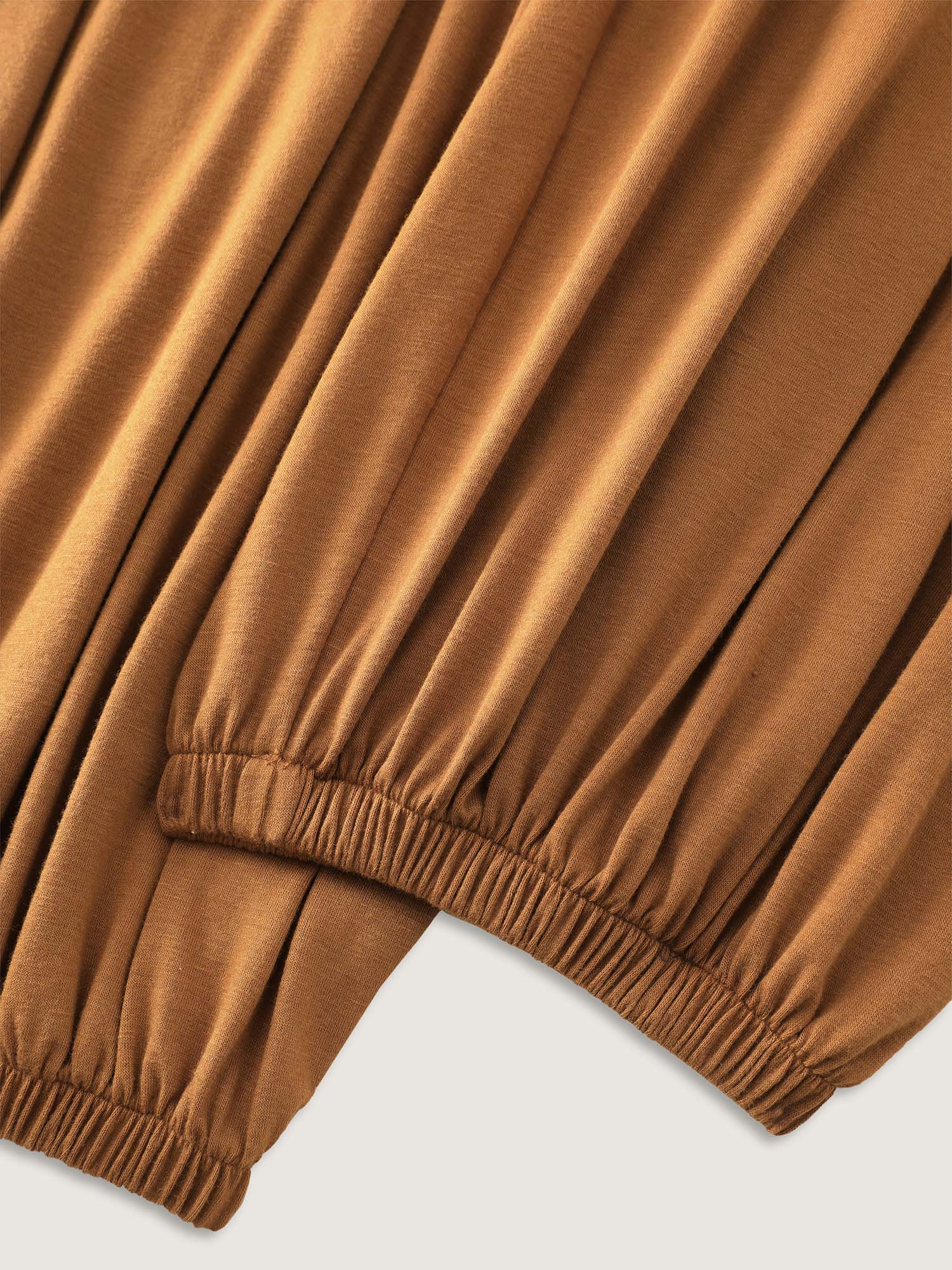Side view of BloomChic Women's Plus Size Supersoft Buttons Pleated Cuffed Hem Lounge Jumpsuit Yellowishbrown not graphics 28/5X