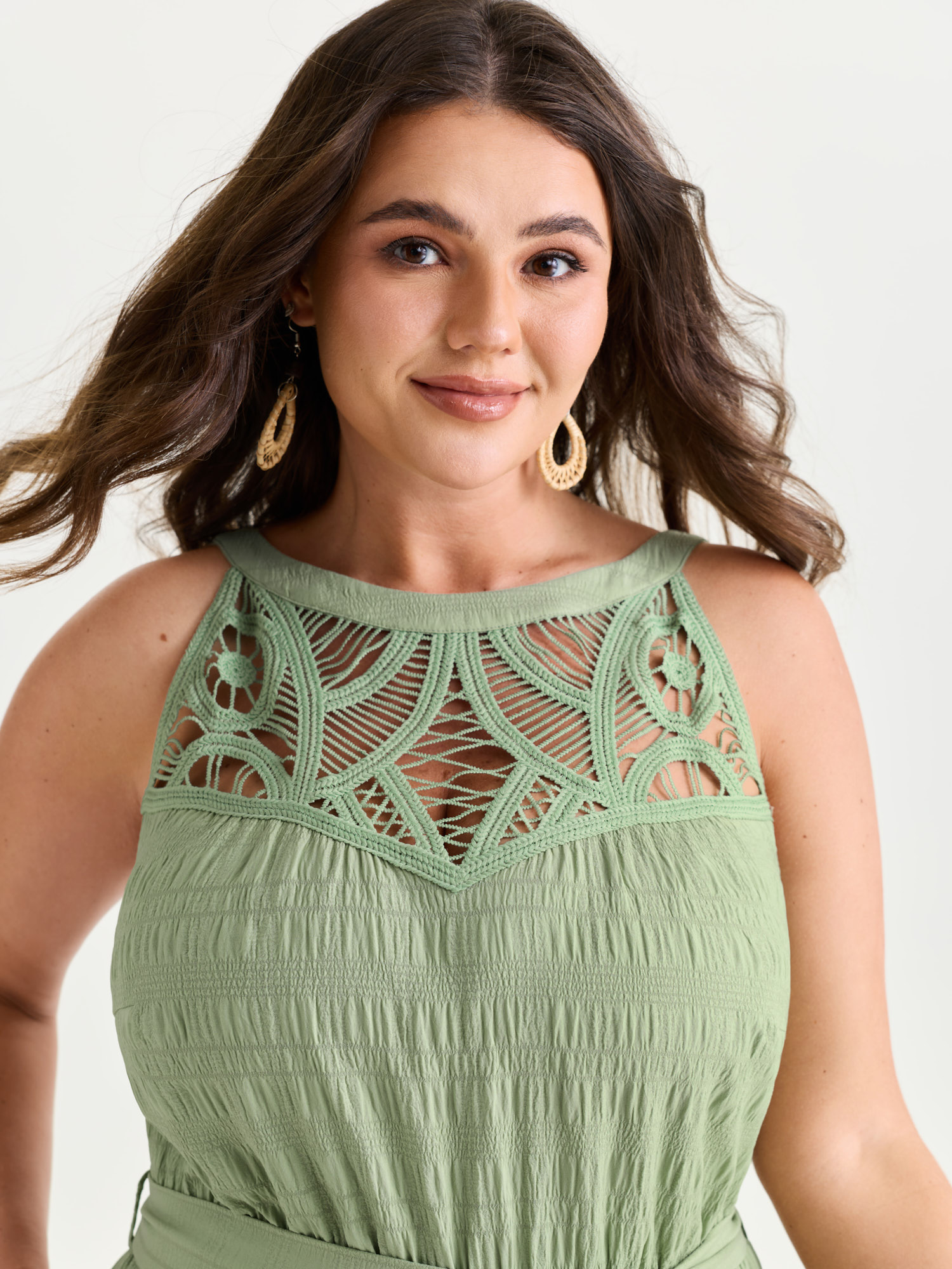 Side view of BloomChic Women's Plus Size Sheer Lace Neckline Ruffled Hem Jumpsuit Greenbean Vacation 14-16/1X