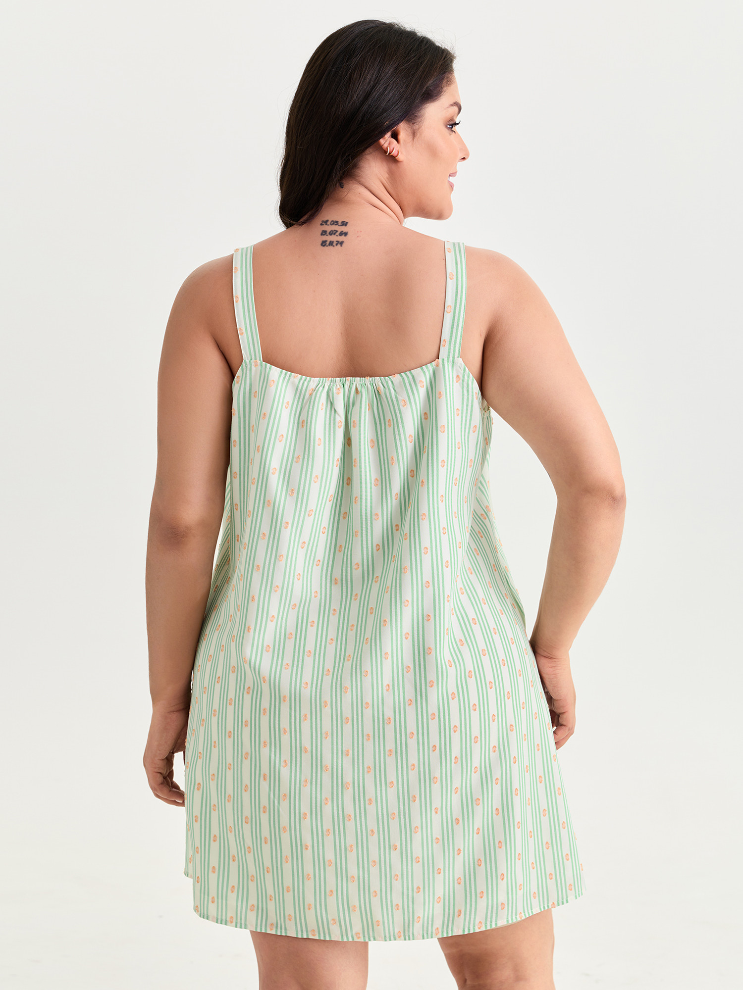 Side view of BloomChic Women's Plus Size Striped Print Relaxed-Fit Lounge Dress Turquoise not graphics Mini 14-16/1X