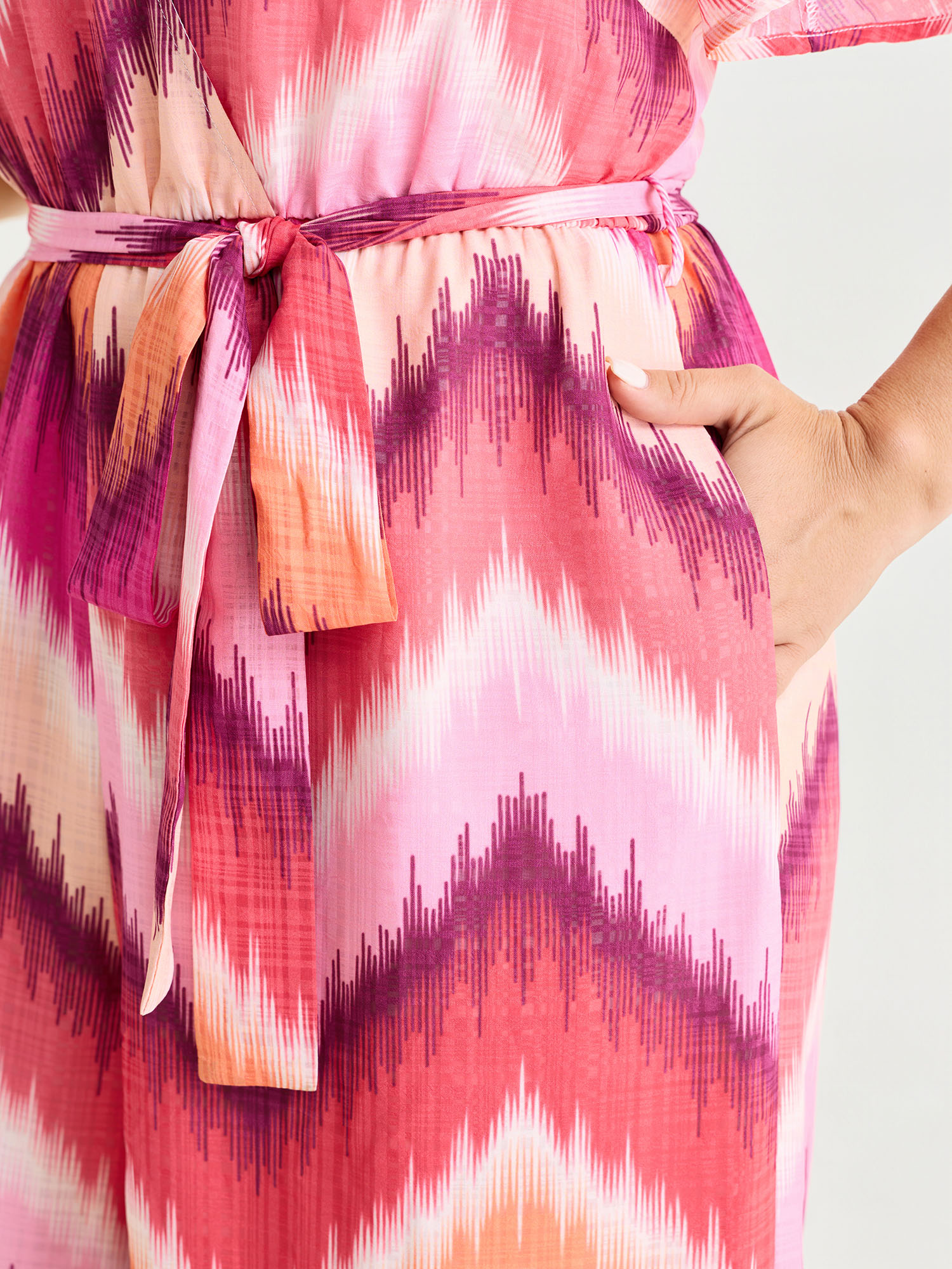 Side view of BloomChic Women's Plus Size Geometric Print Wrap Side-Tie Jumpsuit Multicolor Vacation Relaxed Fit 30/6X