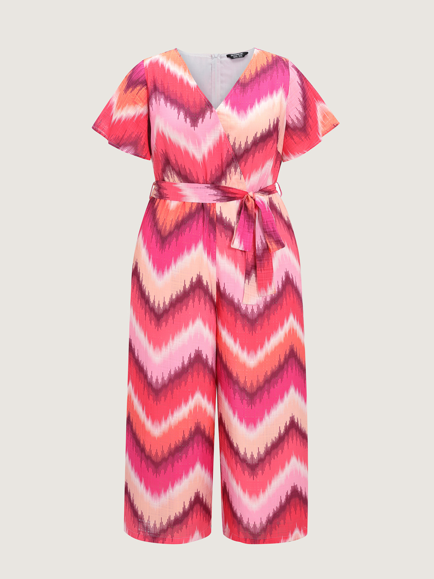 Side view of BloomChic Women's Plus Size Geometric Print Wrap Side-Tie Jumpsuit Multicolor Vacation Relaxed Fit 30/6X