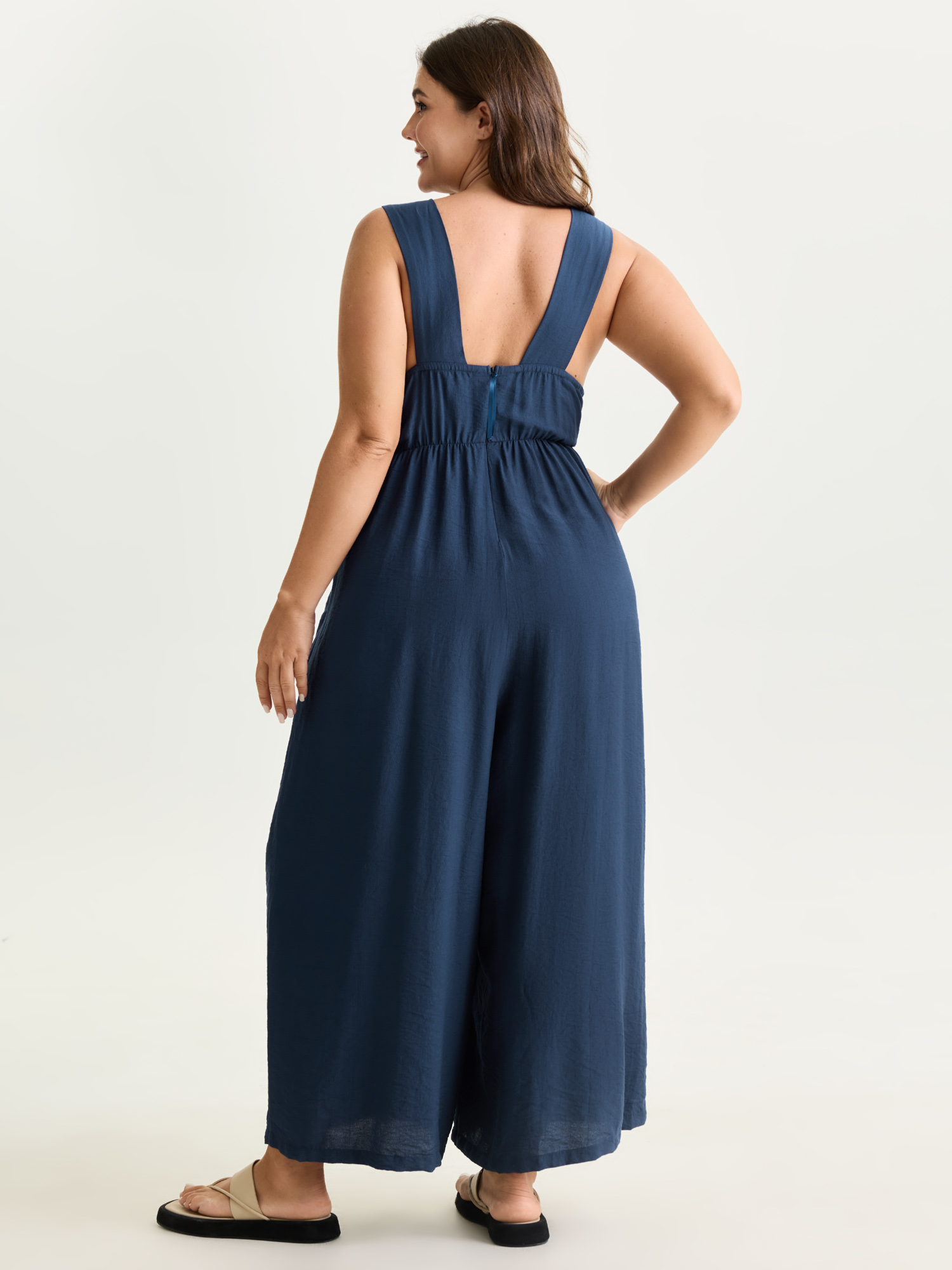 Side view of BloomChic Women's Plus Size Adjustable Waist-Tie Overall Jumpsuit Indigo Casual 12/L