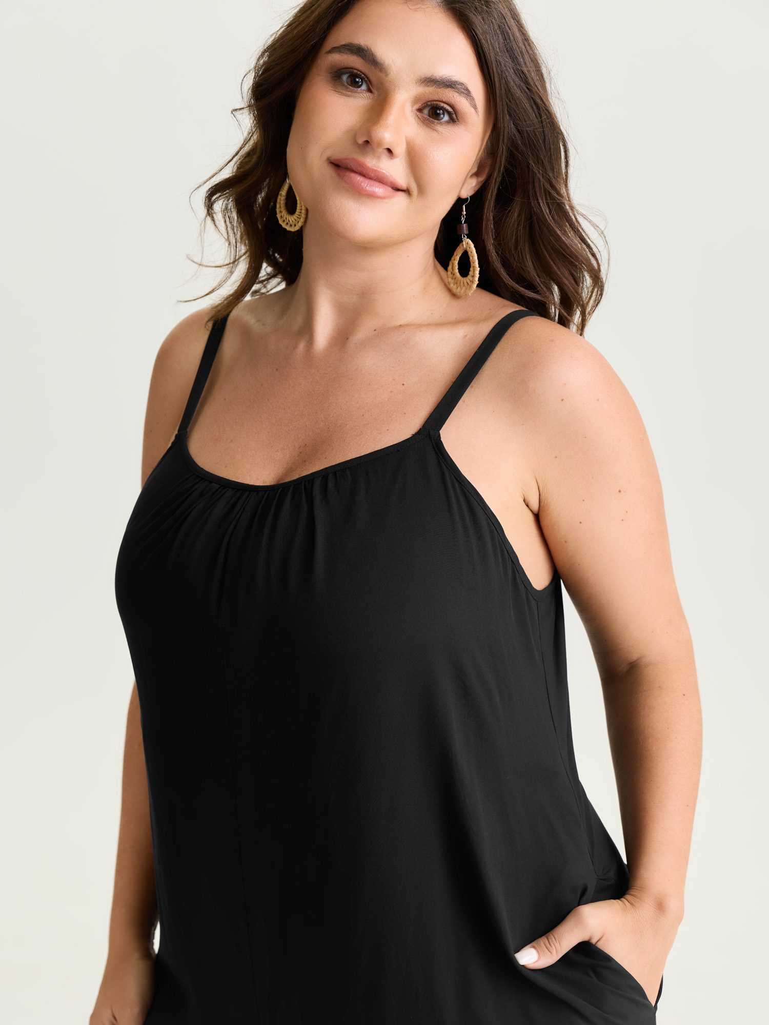 Side view of BloomChic Women's Plus Size Backless Inclusive Flowy Fit Plain Lounge Jumpsuit Black 22-24/3X