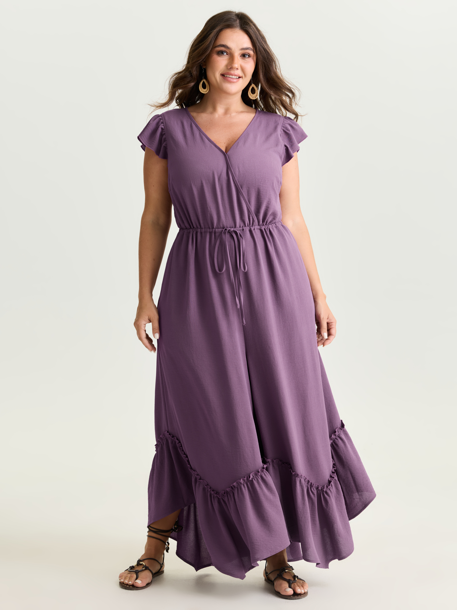 Side view of BloomChic Women's Plus Size Ruffled Drawstring Waist Flowy Jumpsuit Mauve Vacation 10/M