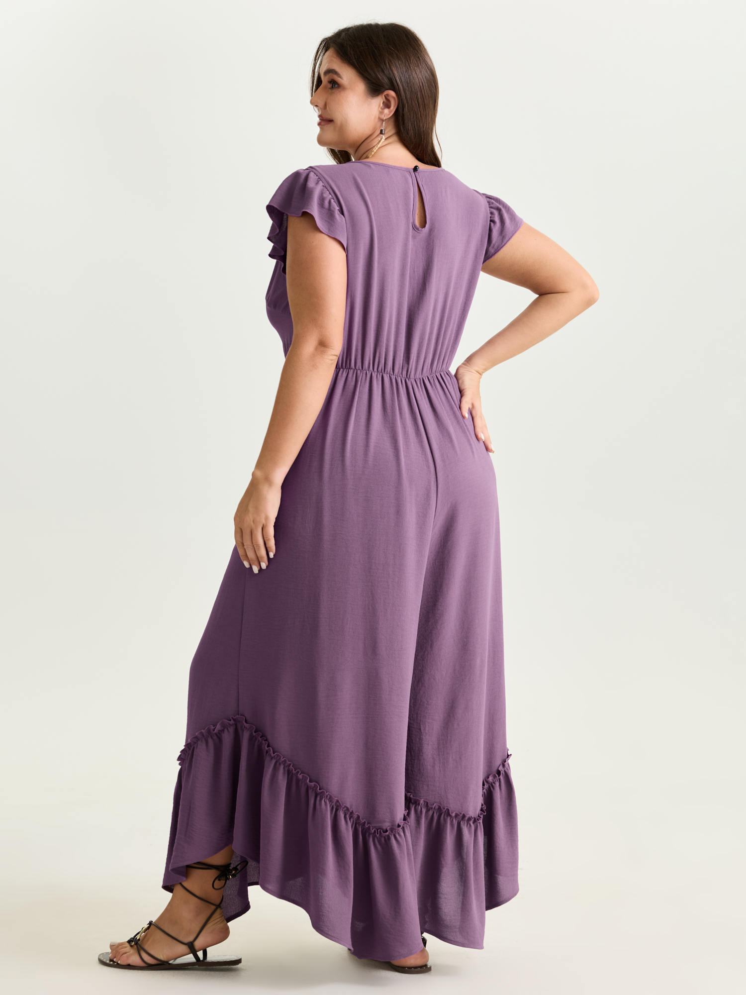 Side view of BloomChic Women's Plus Size Ruffled Drawstring Waist Flowy Jumpsuit Mauve Vacation 10/M
