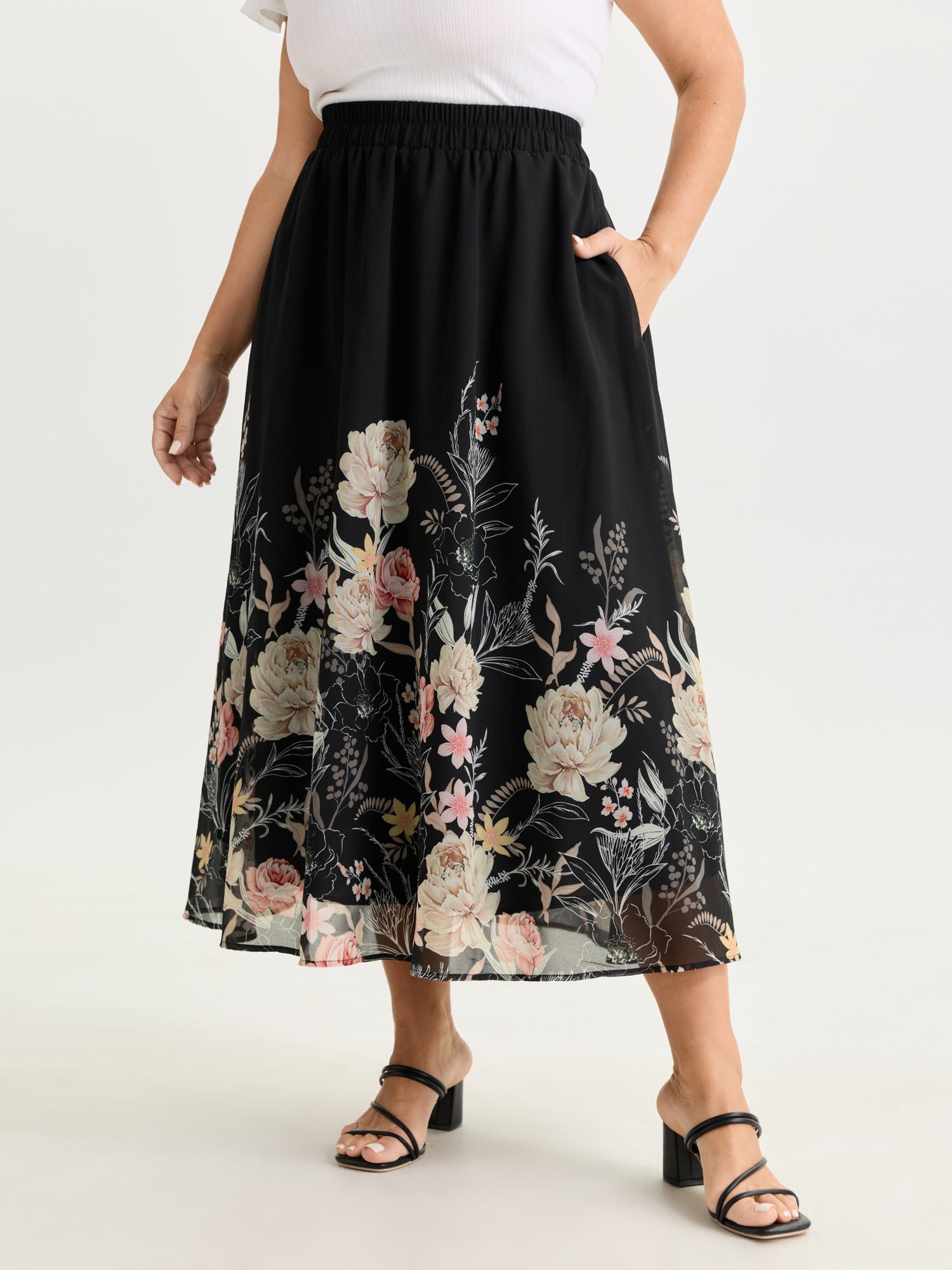 Side view of BloomChic Women's Plus Size Floral Print Flowy Midi Skirt Black Wide Waistband Wide leg Elegant 12/L
