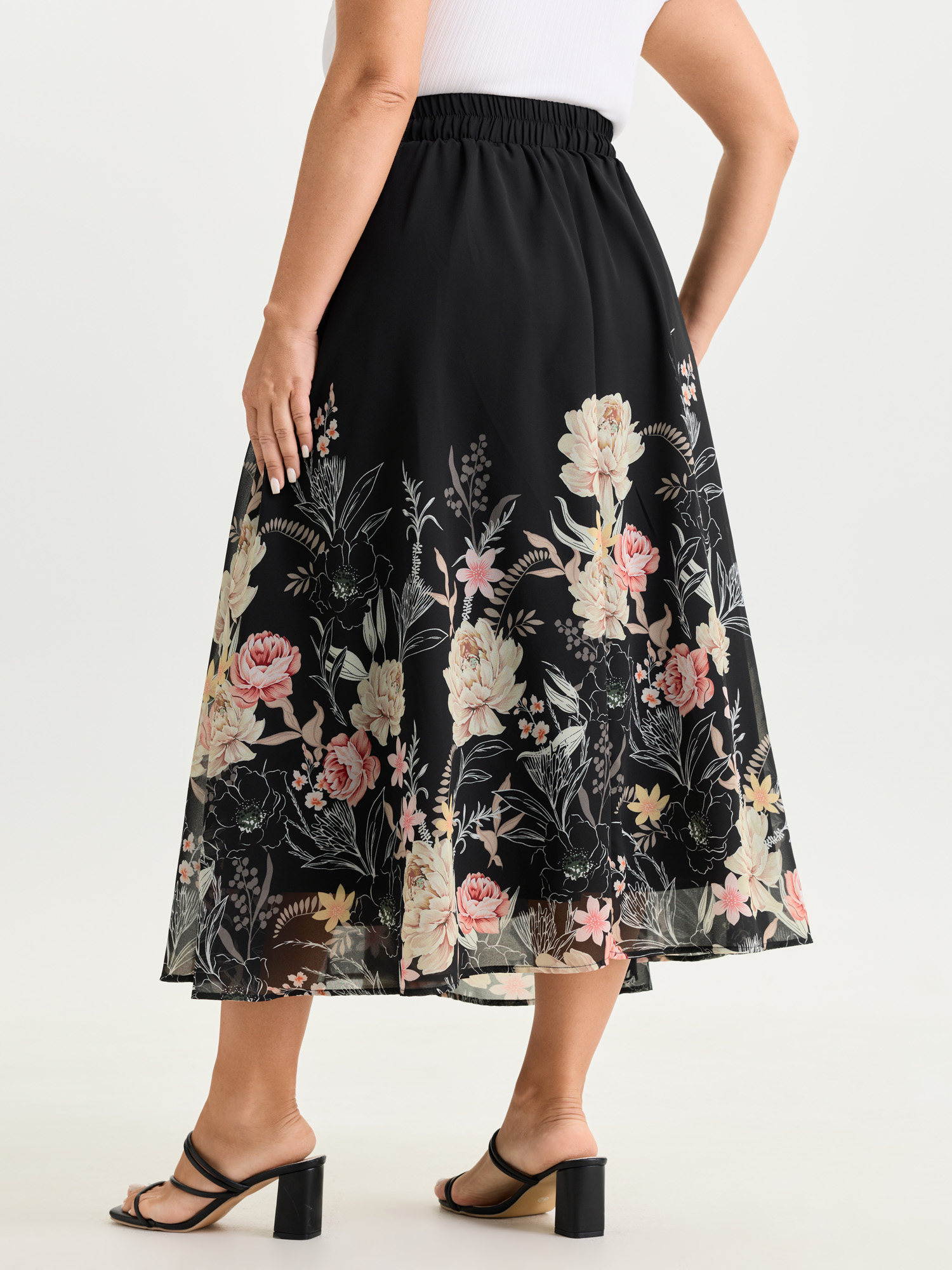 Side view of BloomChic Women's Plus Size Floral Print Flowy Midi Skirt Black Wide Waistband Wide leg Elegant 12/L
