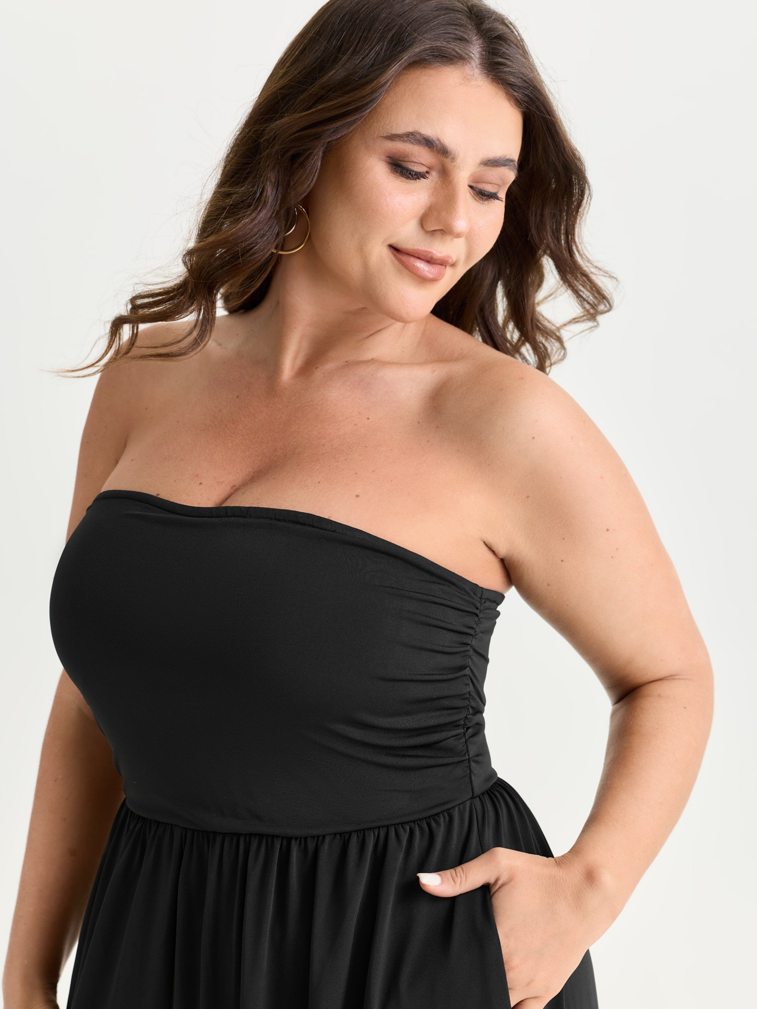 Side view of BloomChic Women's Plus Size Supported Bra Off-Shoulder Stretchy Pockets Jumpsuit Black Vacation 14-16/1X