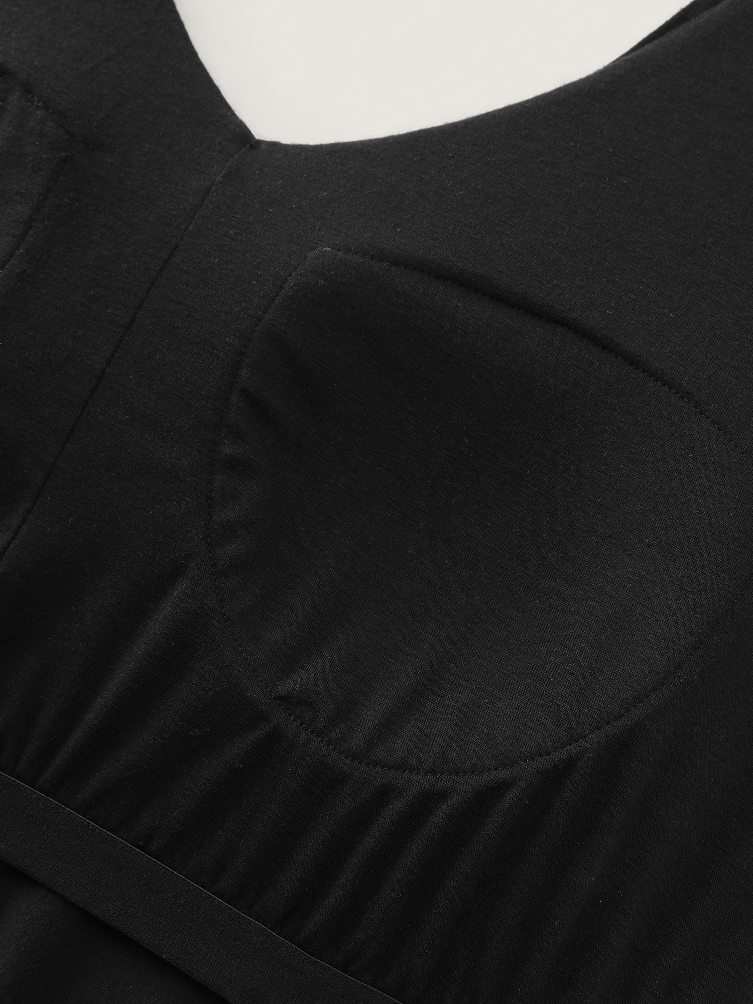 Side view of BloomChic Women's Plus Size Stretchy Deep Back Neckline Jumpsuit Black Casual 30/6X