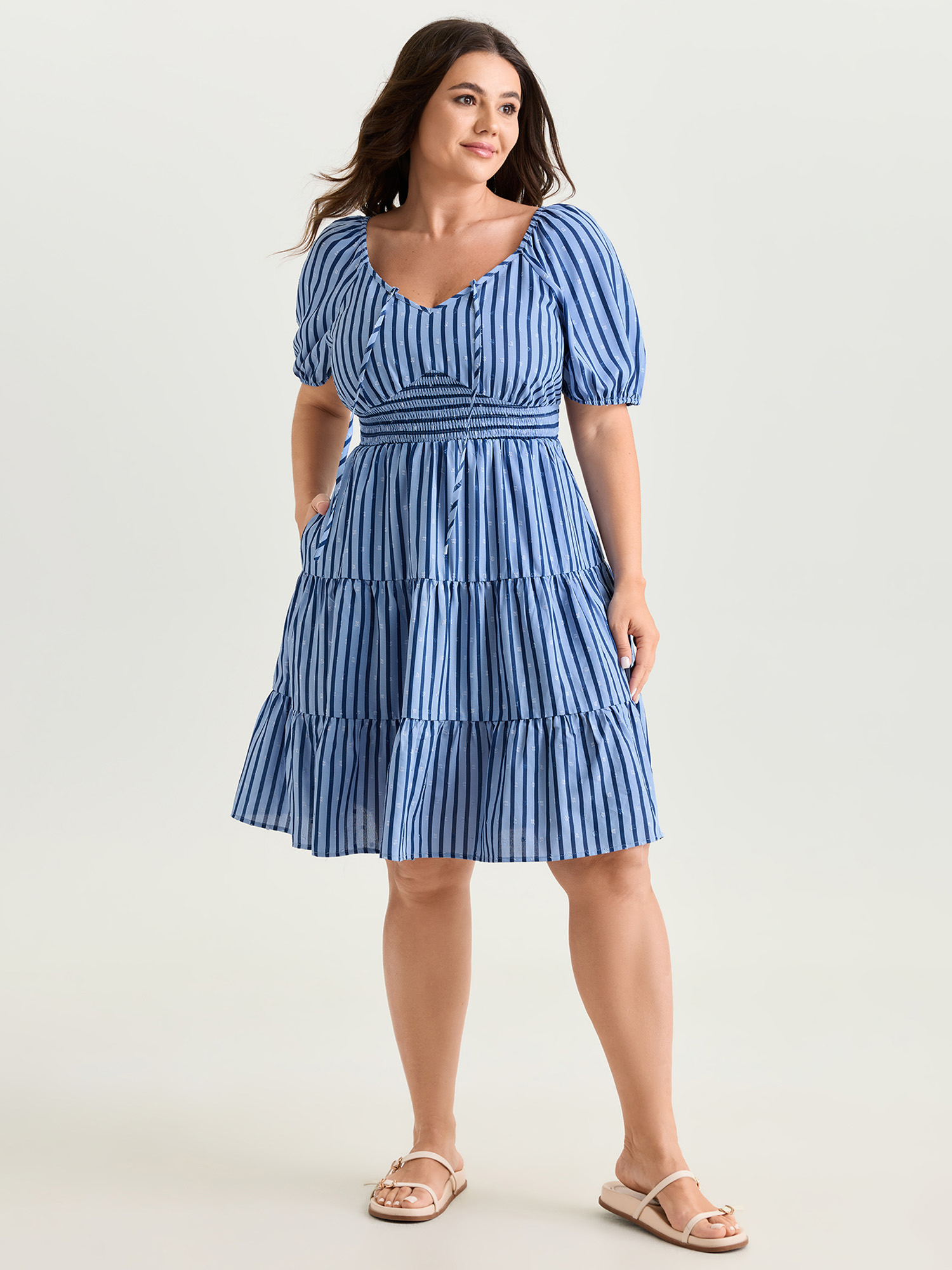 Side view of BloomChic Women's Plus Size Striped Print Neck-Tie Tiered Mini Dress Skyblue Stripes Knee Length Casual Smocked 30/6X
