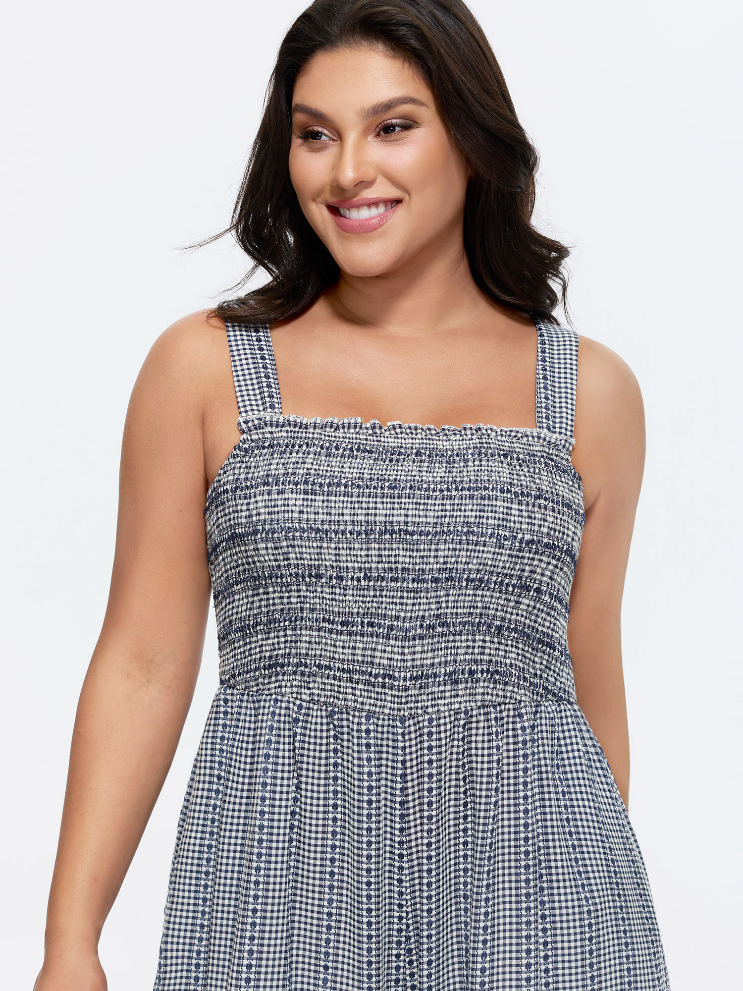 Side view of BloomChic Women's Plus Size Striped Print Shirred Wide-Straps Jumpsuit Indigo Casual 10/M