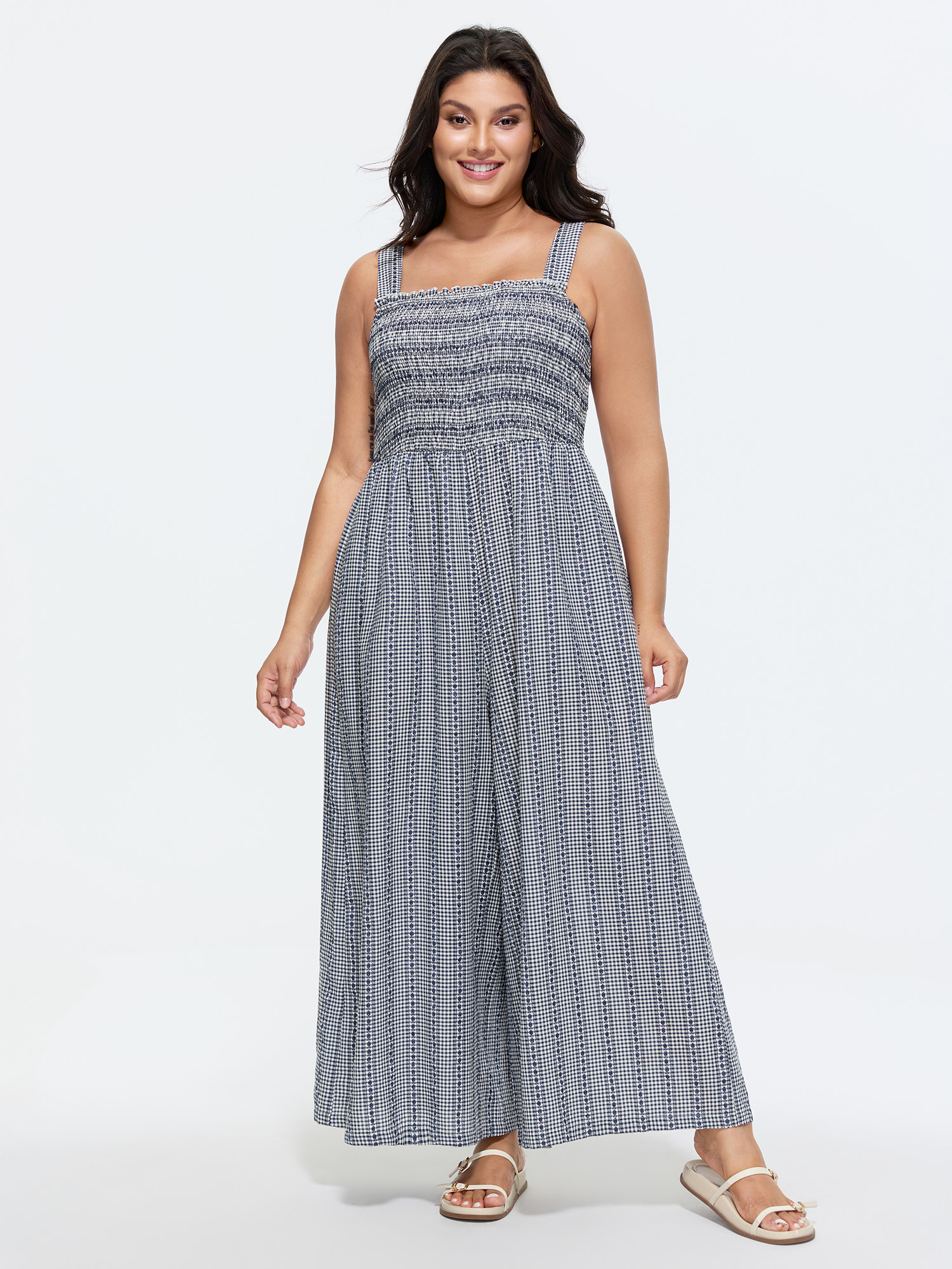 Side view of BloomChic Women's Plus Size Striped Print Shirred Wide-Straps Jumpsuit Indigo Casual 10/M