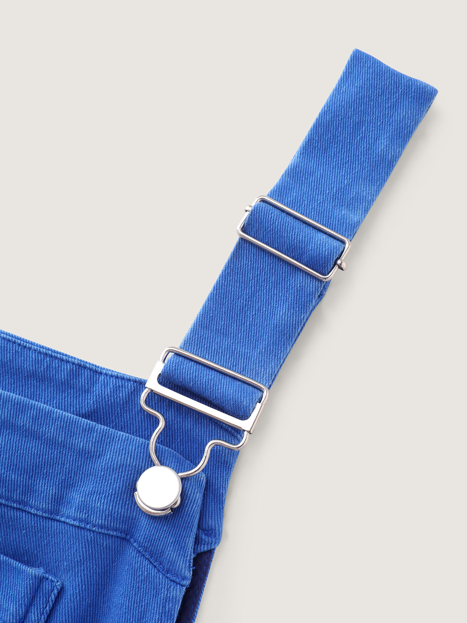 Side view of BloomChic Women's Plus Size Cotton Overall Pockets Folded Hem Romper Brightblue Casual 12/L