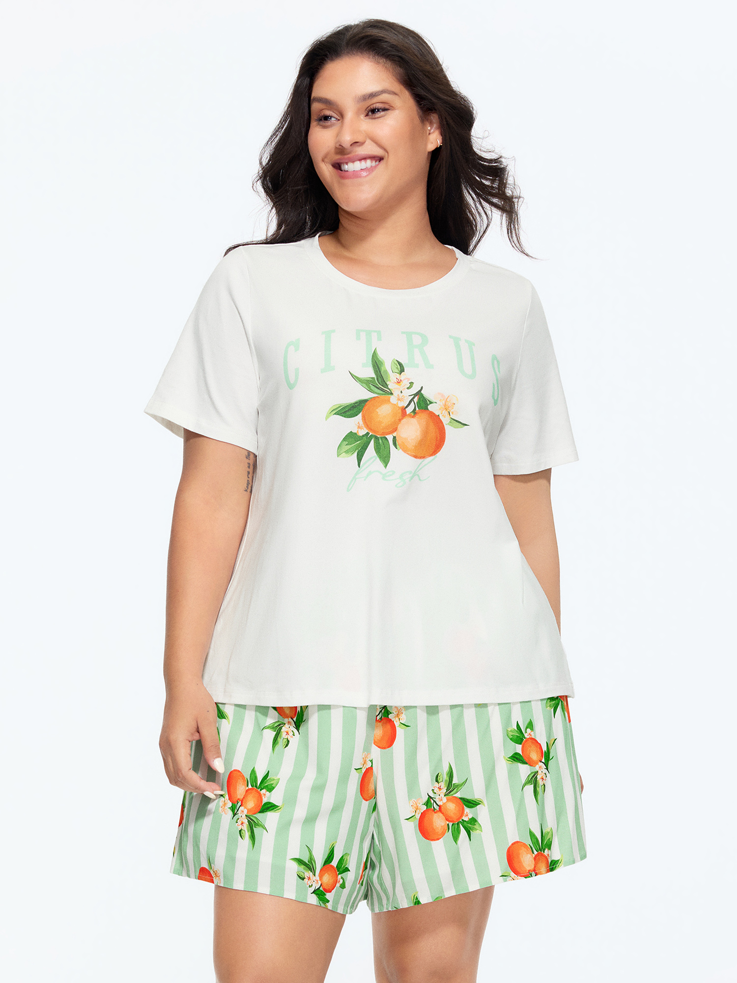 Side view of BloomChic Women's Plus Size Citrus Print Stretchy Lounge Set Greenbean Fruit Short sleeve Smocked 26/4X