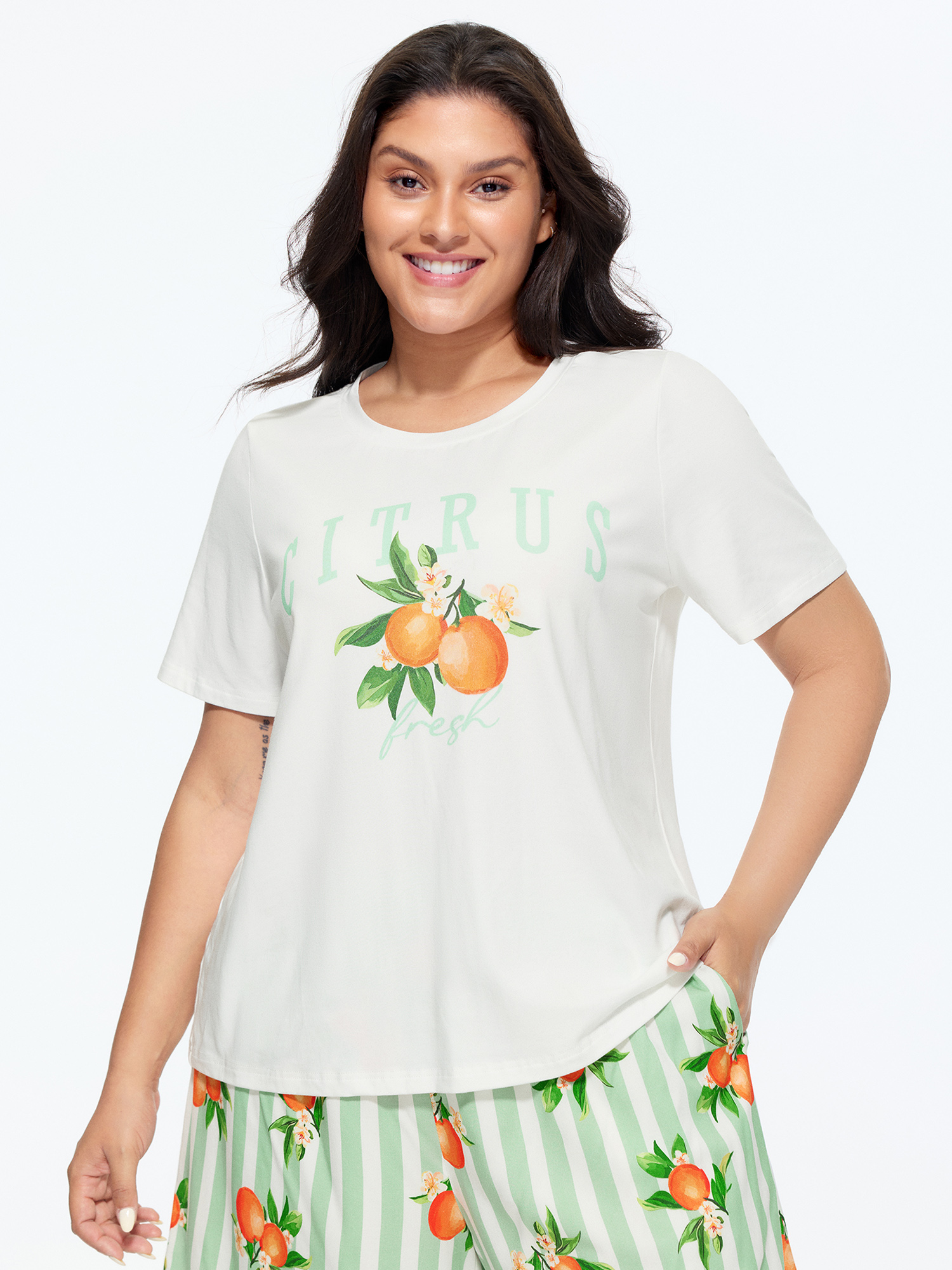 Side view of BloomChic Women's Plus Size Citrus Print Stretchy Lounge Set Greenbean Fruit Short sleeve Smocked 26/4X
