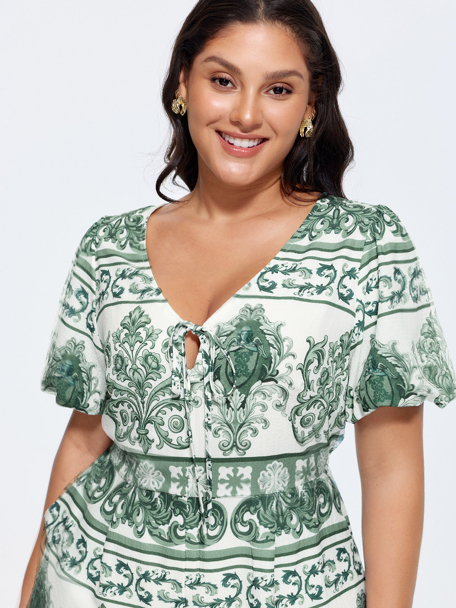 Side view of BloomChic Women's Plus Size Paisley Print Pockets Wide-Leg Romper Teal Elegant Fitted 18-20/2X