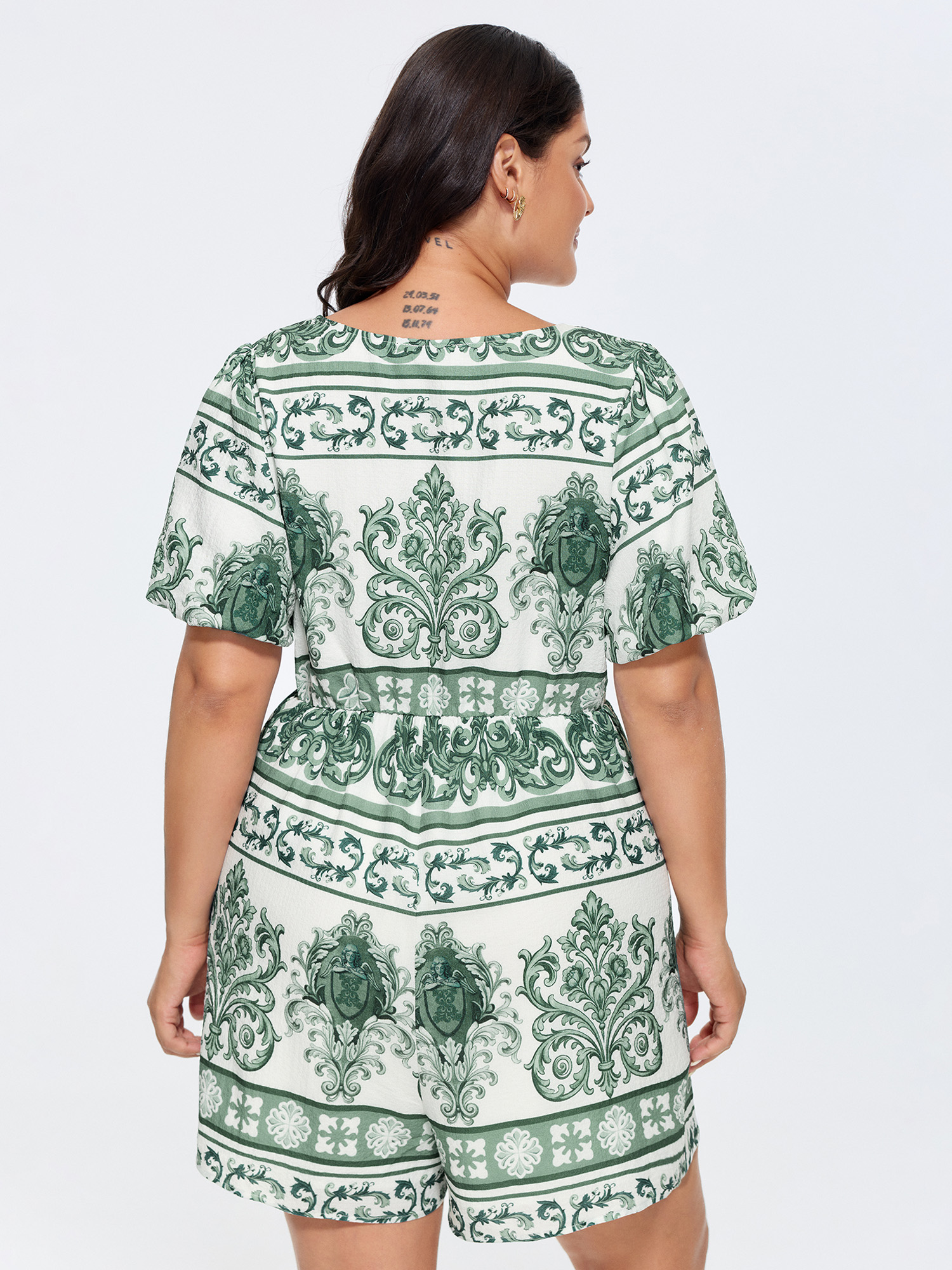 Side view of BloomChic Women's Plus Size Paisley Print Pockets Wide-Leg Romper Teal Elegant Fitted 18-20/2X