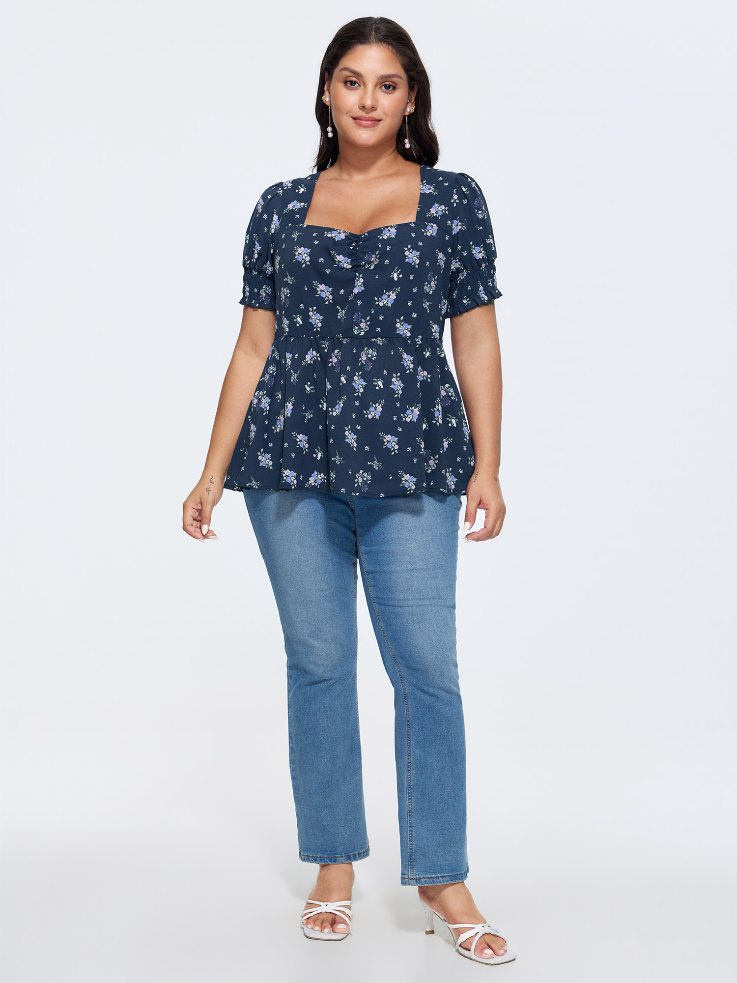 Side view of BloomChic Women's Plus Size Floral Print Ruched Fit And Flare Blouse DarkBlue Ditsy Floral Elegant Short sleeve Sweetheart Neck 30/6X