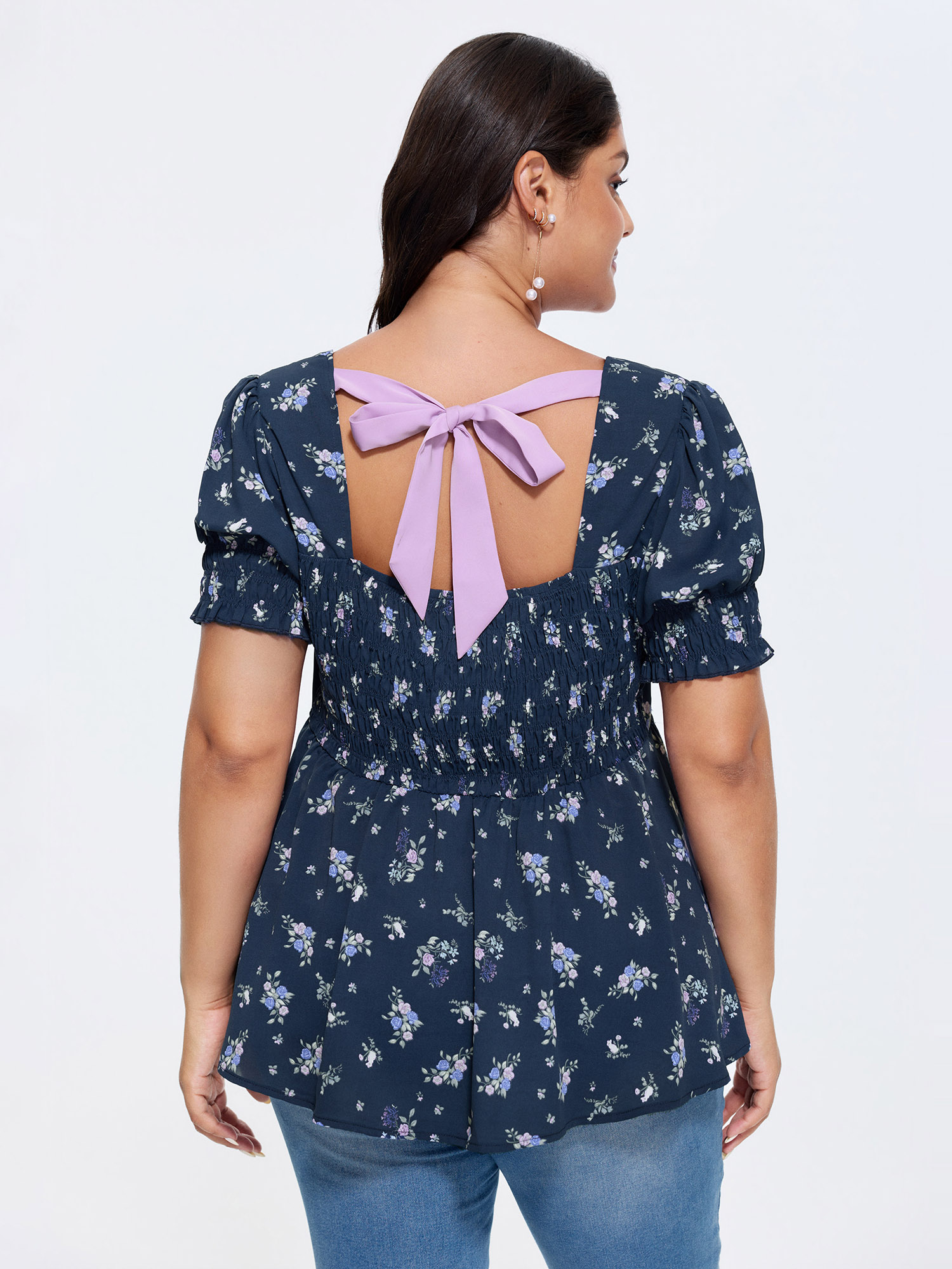 Side view of BloomChic Women's Plus Size Floral Print Ruched Fit And Flare Blouse DarkBlue Ditsy Floral Elegant Short sleeve Sweetheart Neck 30/6X
