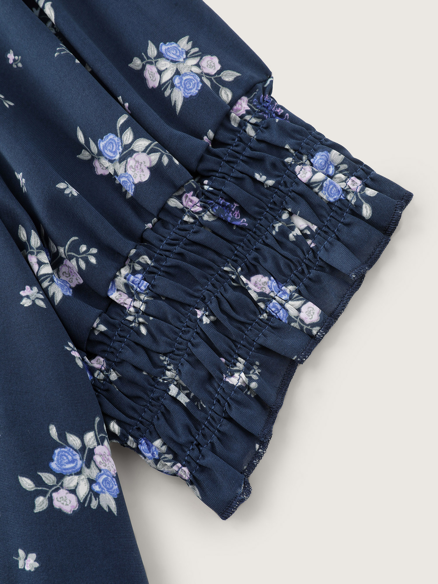 Side view of BloomChic Women's Plus Size Floral Print Ruched Fit And Flare Blouse DarkBlue Ditsy Floral Elegant Short sleeve Sweetheart Neck 30/6X