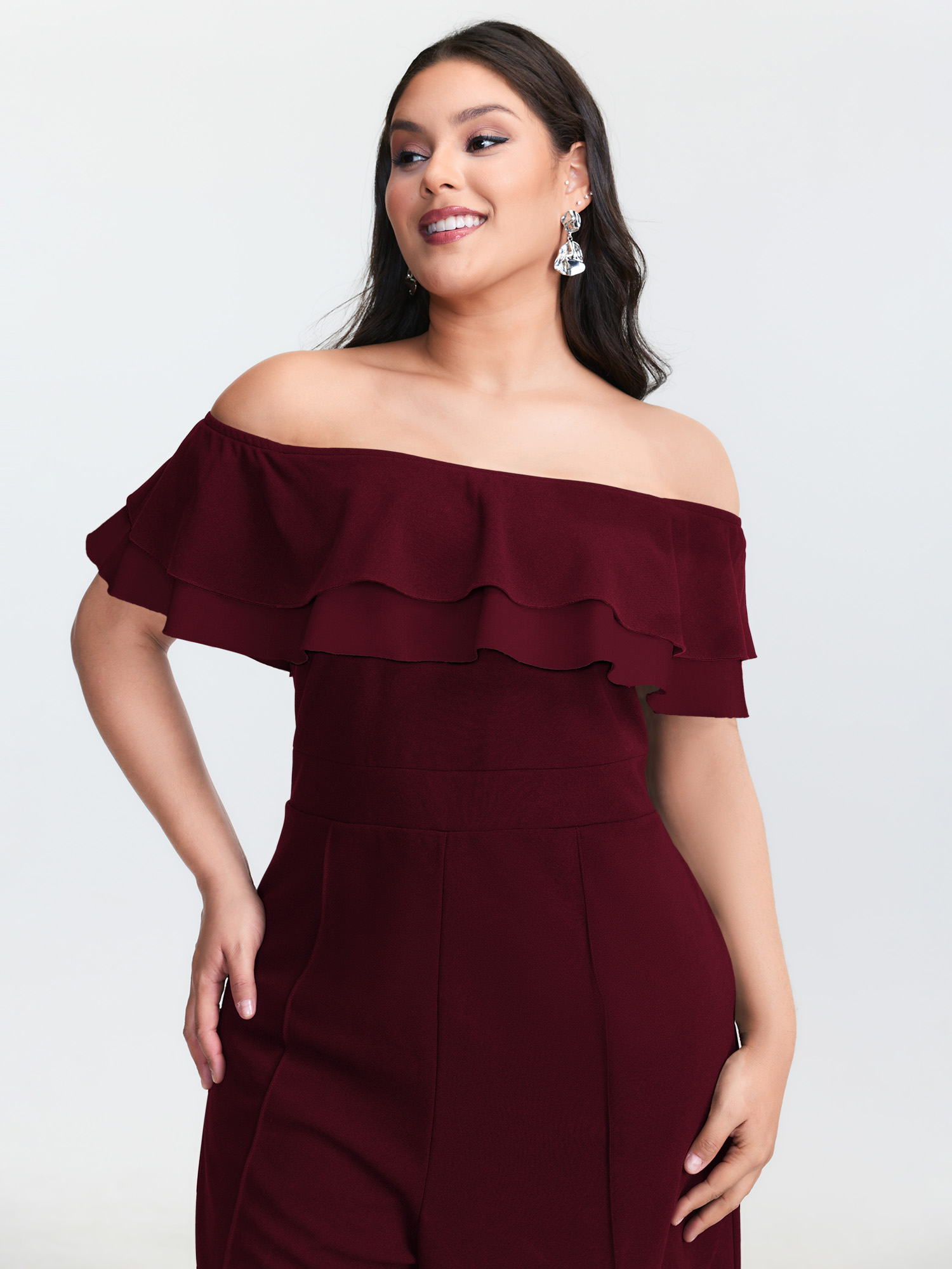 Side view of BloomChic Women's Plus Size Off-Shoulder Lotus Leaf Neckline Jumpsuit Deepred Elegant Fitted 22-24/3X