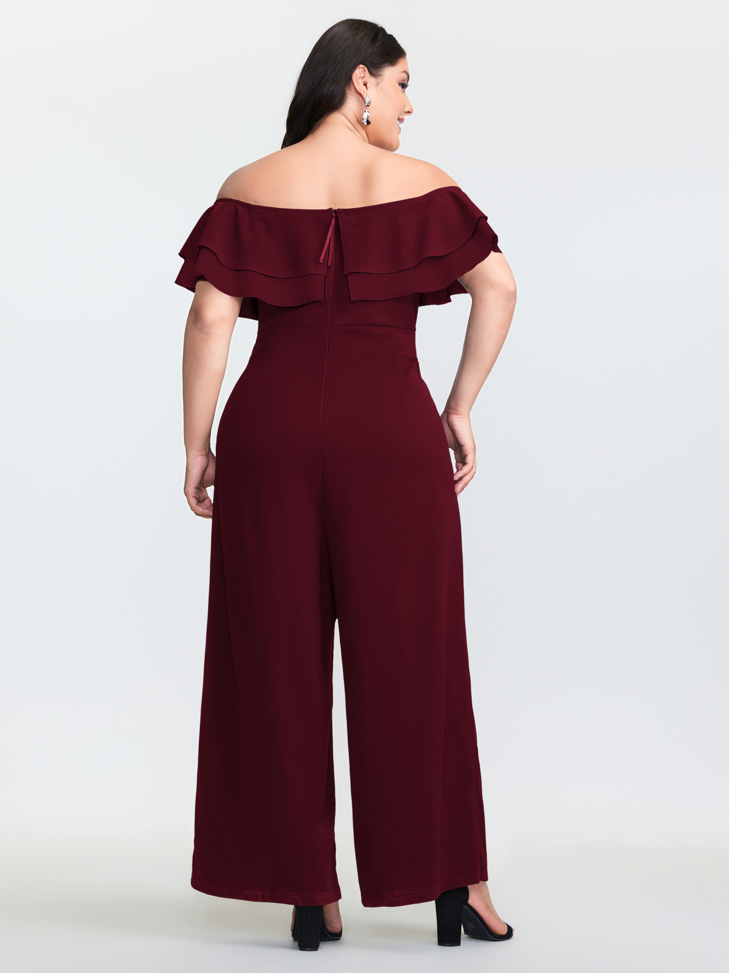 Side view of BloomChic Women's Plus Size Off-Shoulder Lotus Leaf Neckline Jumpsuit Deepred Elegant Fitted 22-24/3X