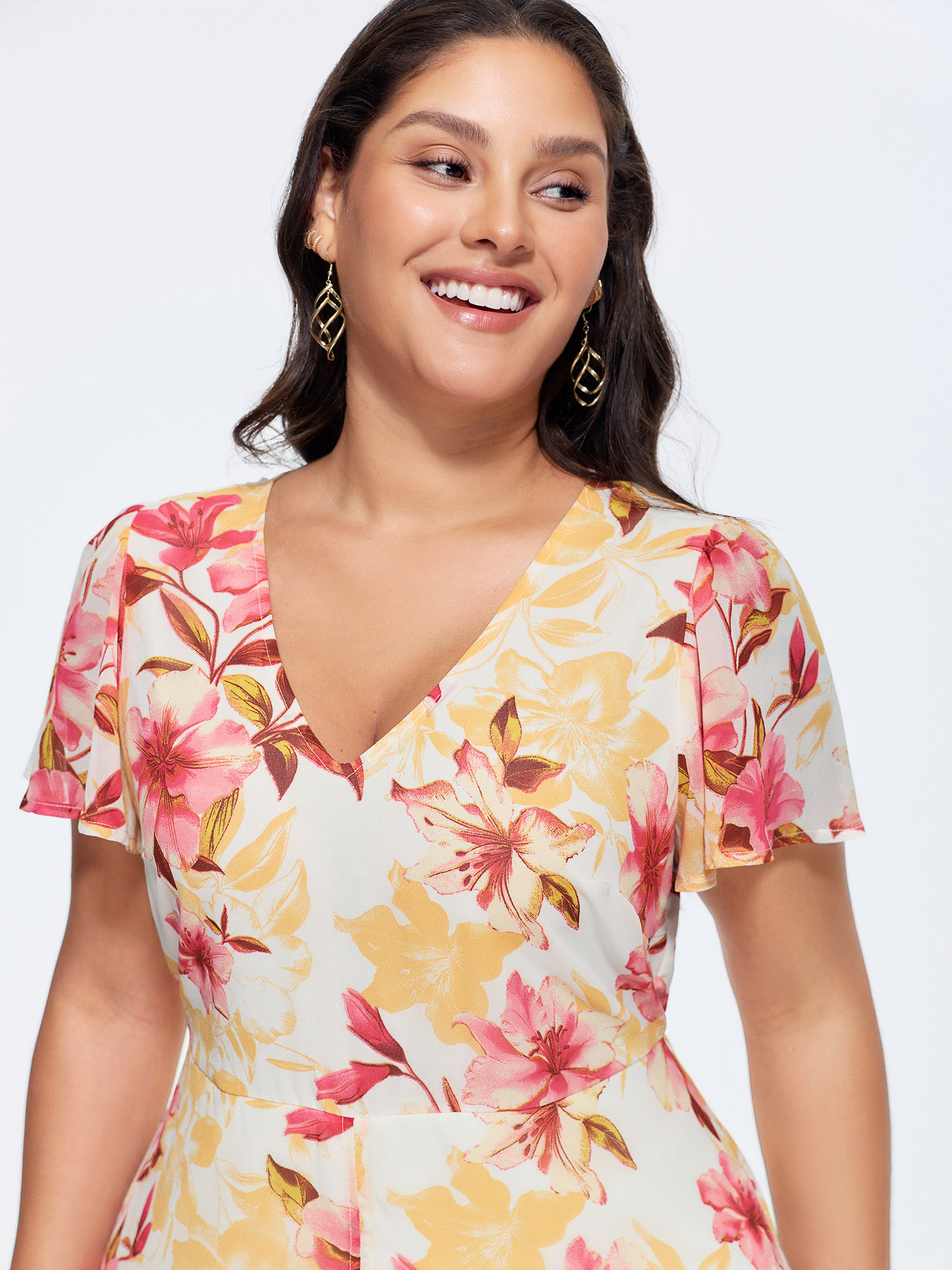 Side view of BloomChic Women's Plus Size Floral Print Stretchy Layered Jumpsuit MistyRose Elegant Fitted 28/5X