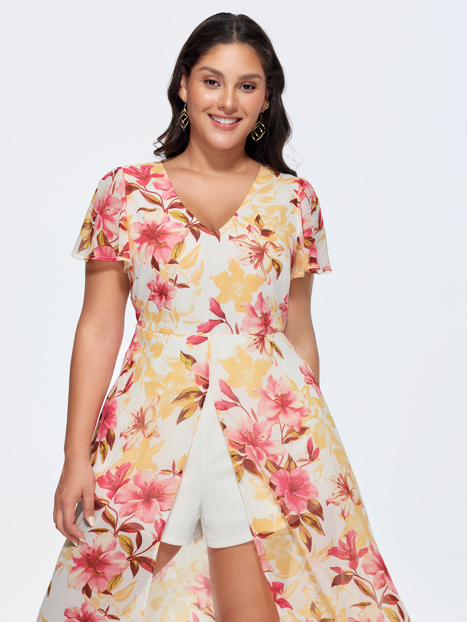 Side view of BloomChic Women's Plus Size Floral Print Stretchy Layered Jumpsuit MistyRose Elegant Fitted 28/5X