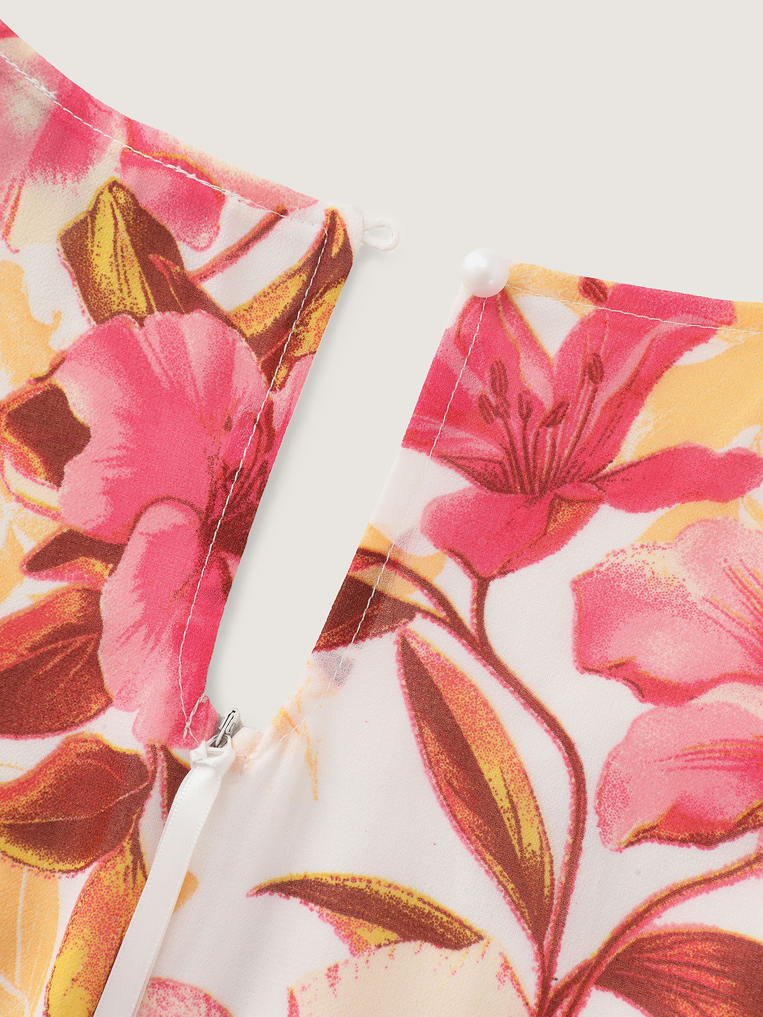 Side view of BloomChic Women's Plus Size Floral Print Stretchy Layered Jumpsuit MistyRose Elegant Fitted 28/5X