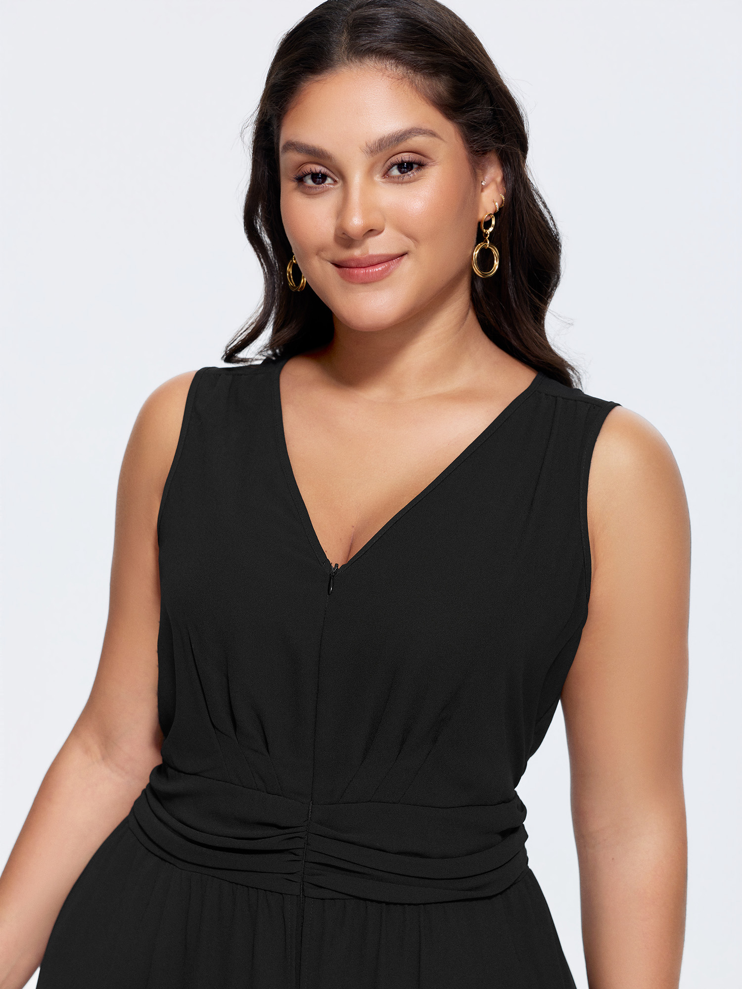 Side view of BloomChic Women's Plus Size Layered Mesh Flowy Jumpsuit Black Elegant Fitted 12/L