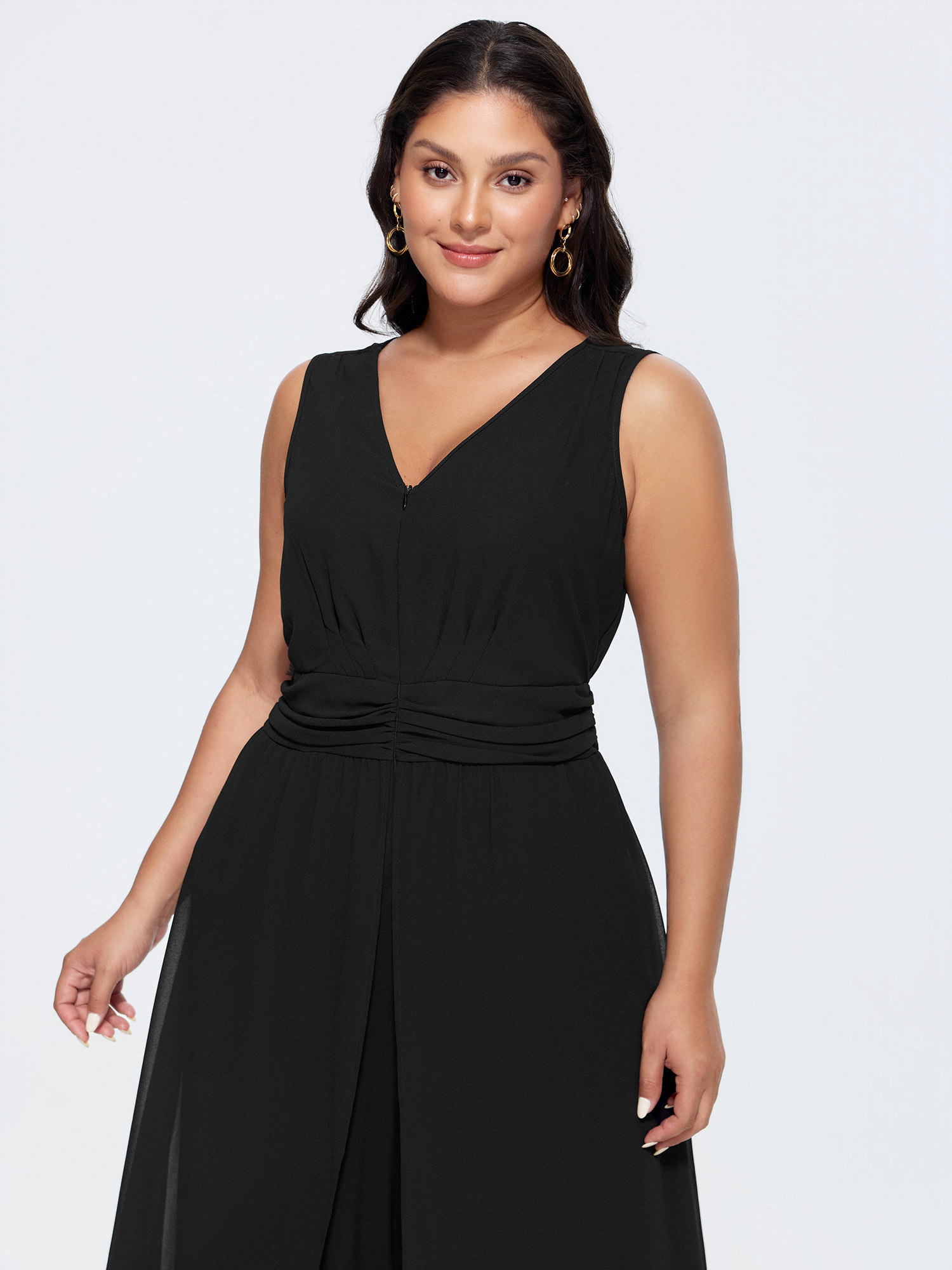 Side view of BloomChic Women's Plus Size Layered Mesh Flowy Jumpsuit Black Elegant Fitted 12/L