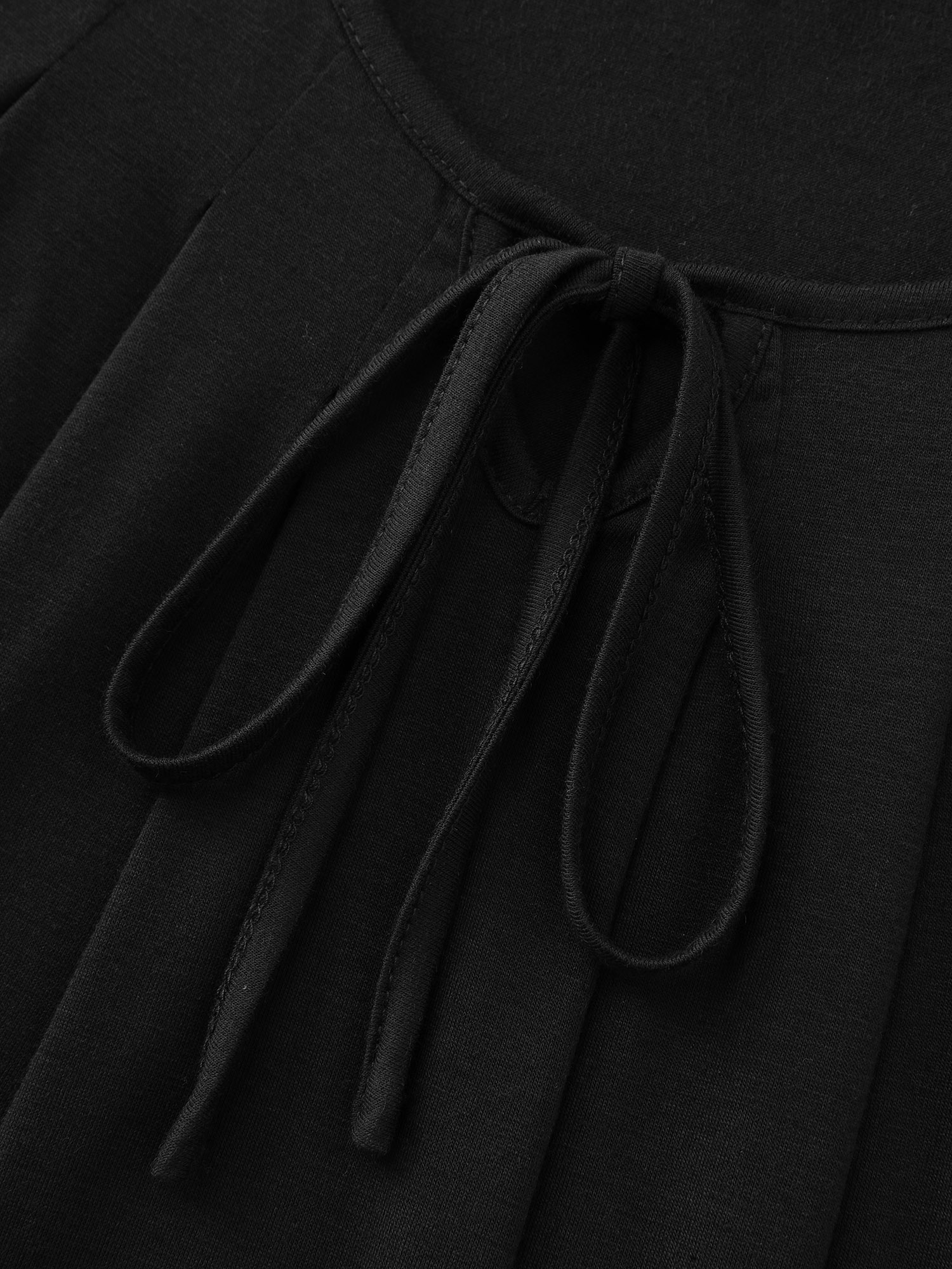 Side view of BloomChic Women's Plus Size Supersoft Pleated Knotted Flowy Lounge Dress Black Knee Length 10/M
