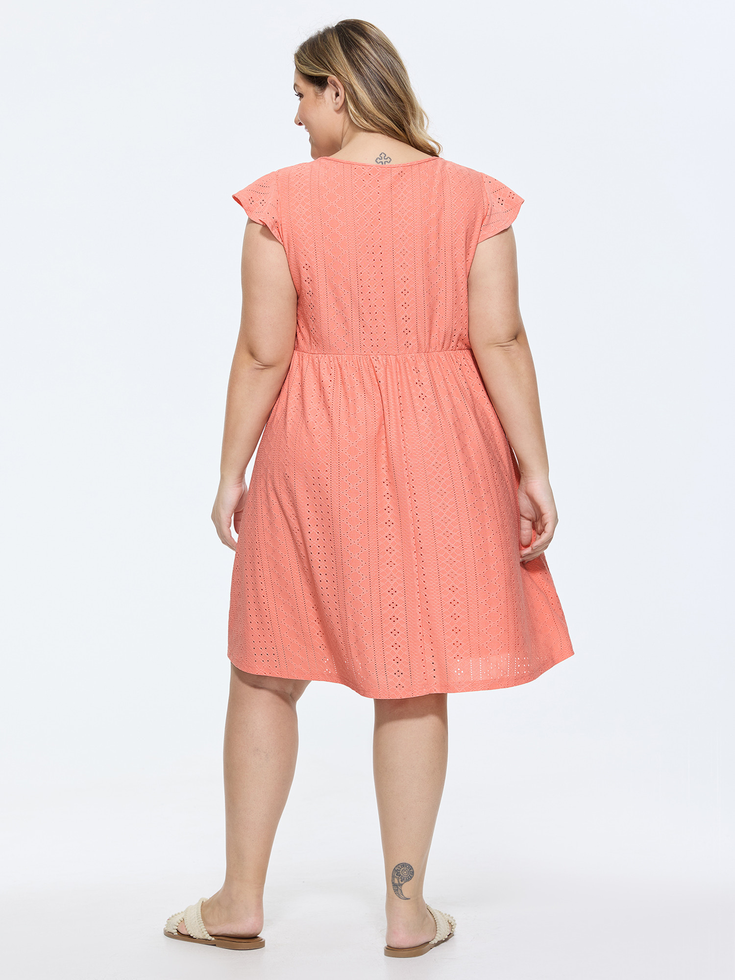 Side view of BloomChic Women's Plus Size Eyelet Textured Flutter Sleeve Mini Dress Crepe Solid Knee Length Casual Lace Trim 30/6X