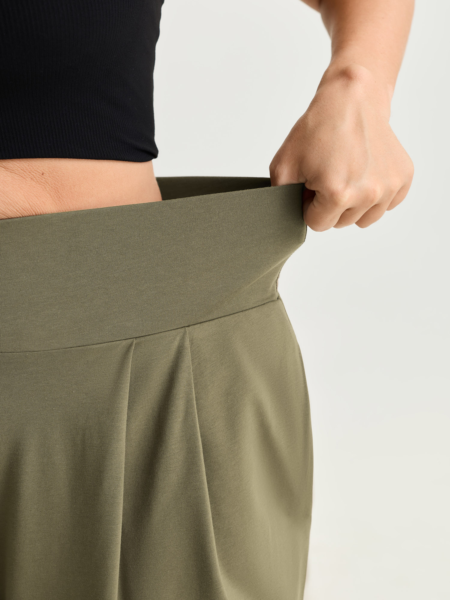 Side view of BloomChic Women's Plus Size Cotton Stretchy Wide Waistband Jogger Lounge Bottoms ArmyGreen Cropped 26/4X