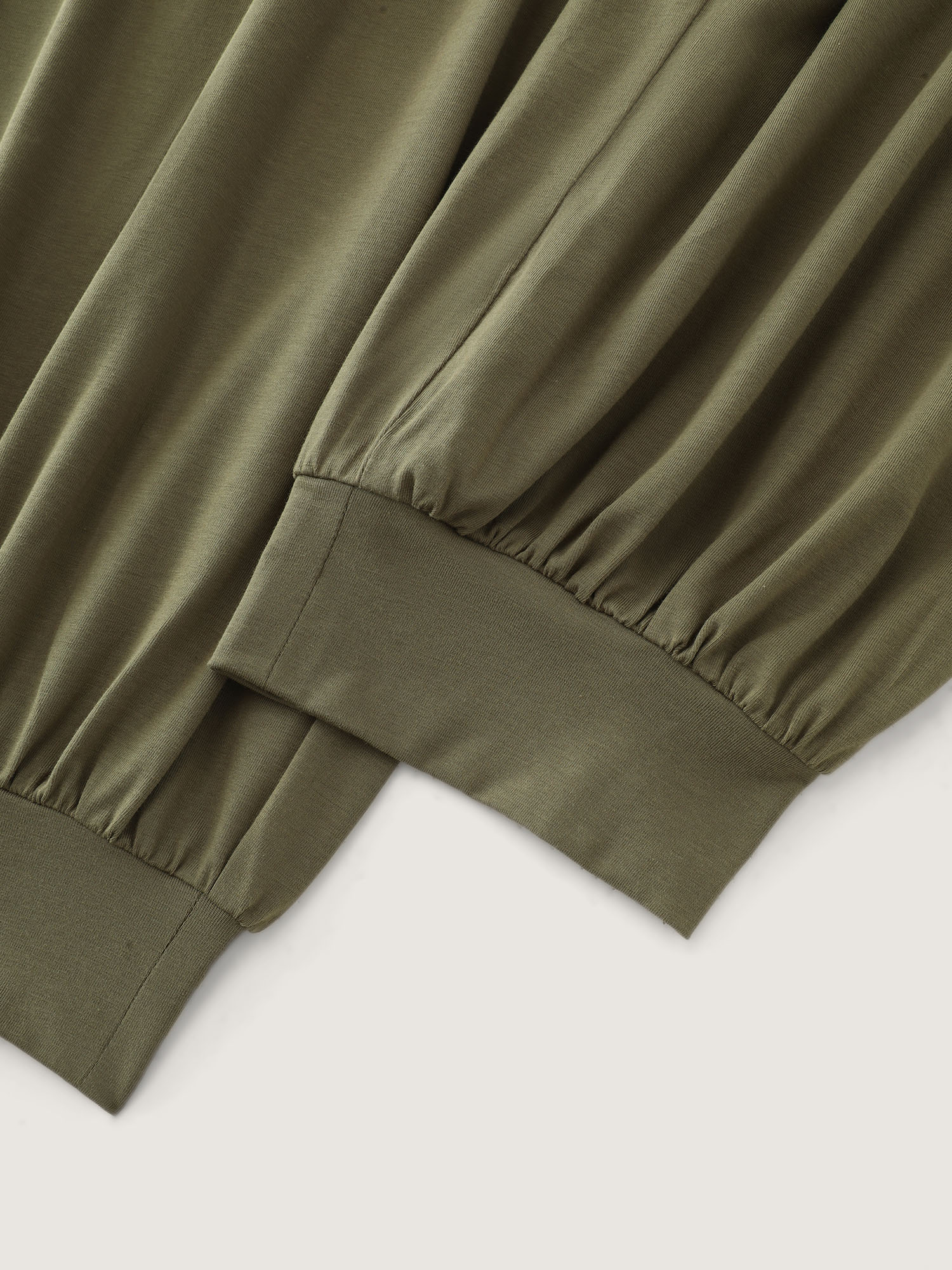 Side view of BloomChic Women's Plus Size Cotton Stretchy Wide Waistband Jogger Lounge Bottoms ArmyGreen Cropped 26/4X