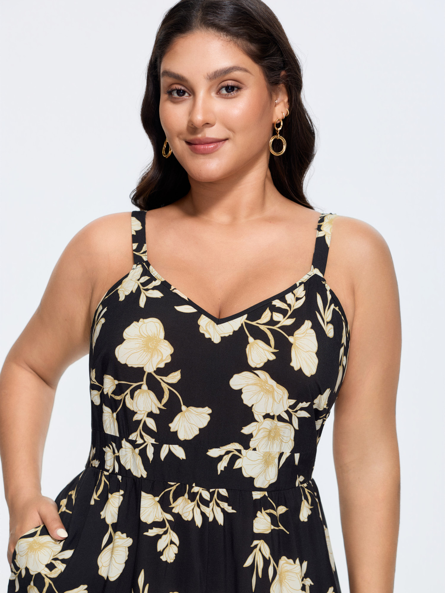 Side view of BloomChic Women's Plus Size Floral Print Shirred Back Jumpsuit Black Elegant Relaxed Fit 12/L