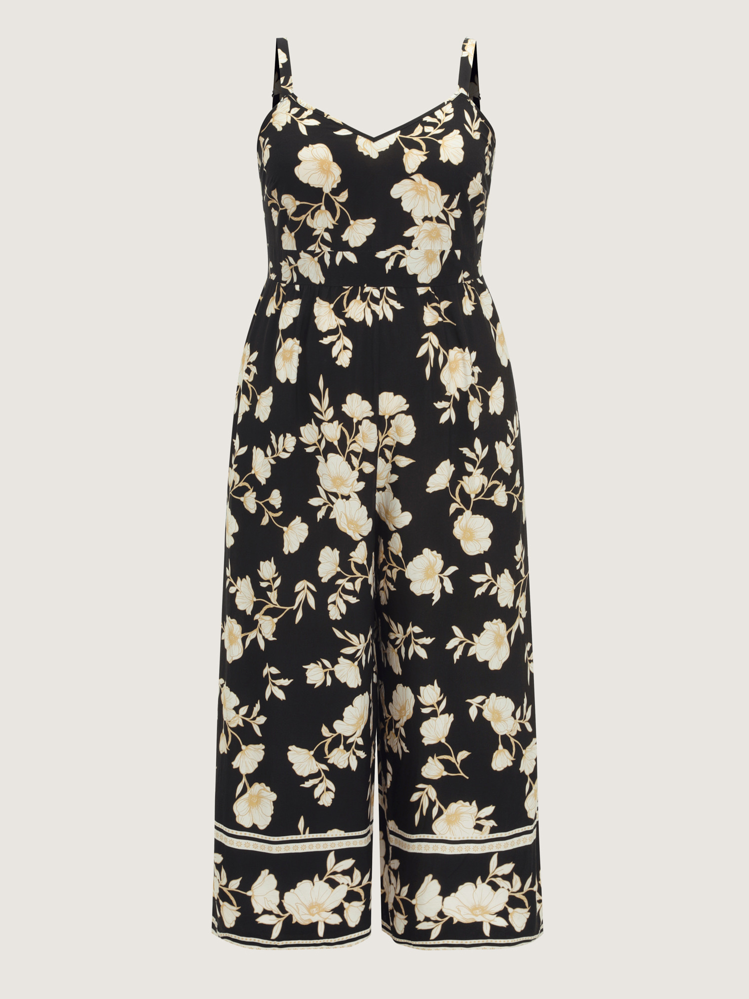 Side view of BloomChic Women's Plus Size Floral Print Shirred Back Jumpsuit Black Elegant Relaxed Fit 12/L