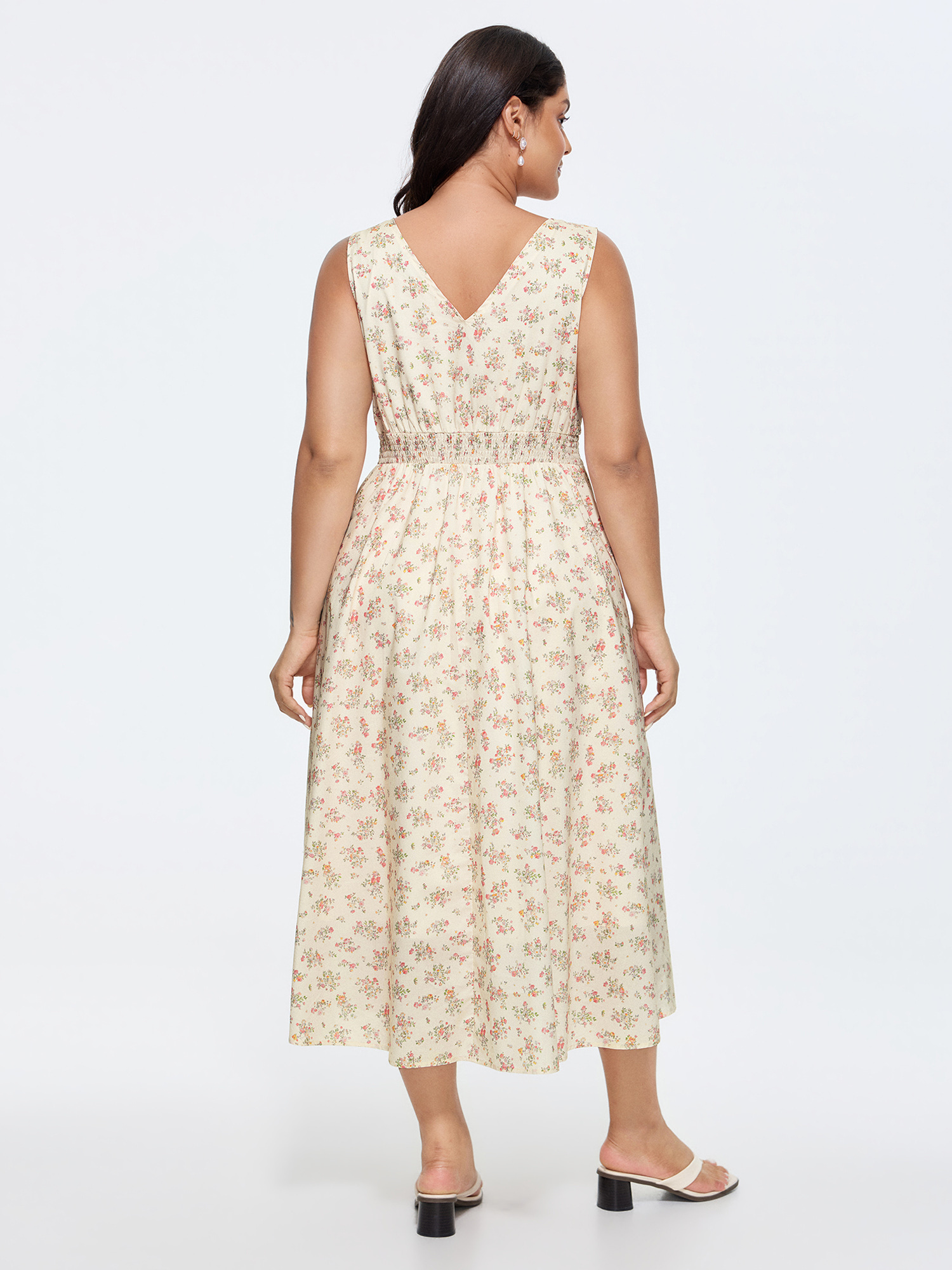 Side view of BloomChic Women's Plus Size Sweet Floral Print Cinched-Waist Midi Dress Beige Ditsy Floral Maxi Elegant Smocked 30/6X