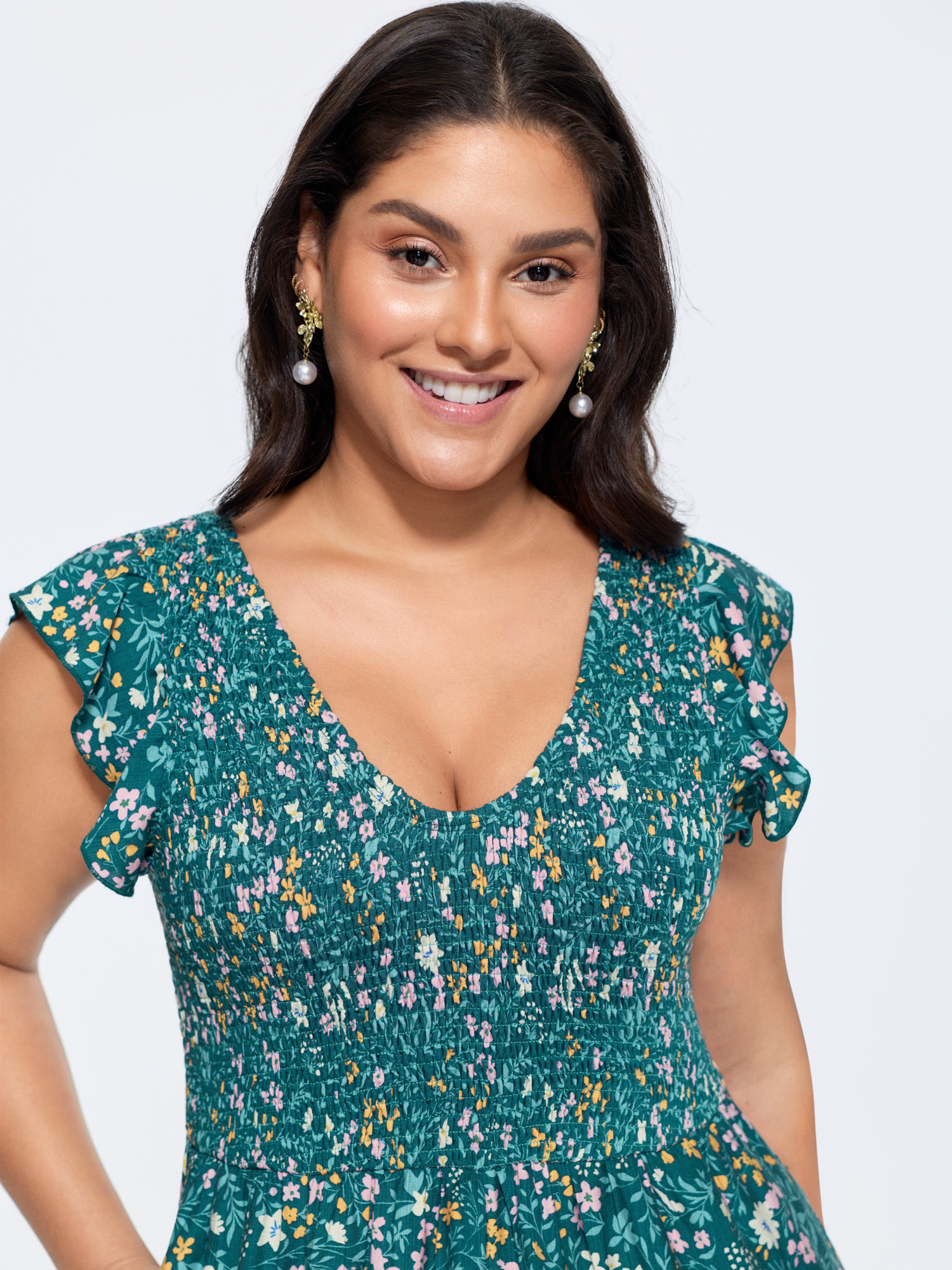 Side view of BloomChic Women's Plus Size Breezy Floral Print Flutter Sleeve Jumpsuit Mediumblue Elegant 26/4X