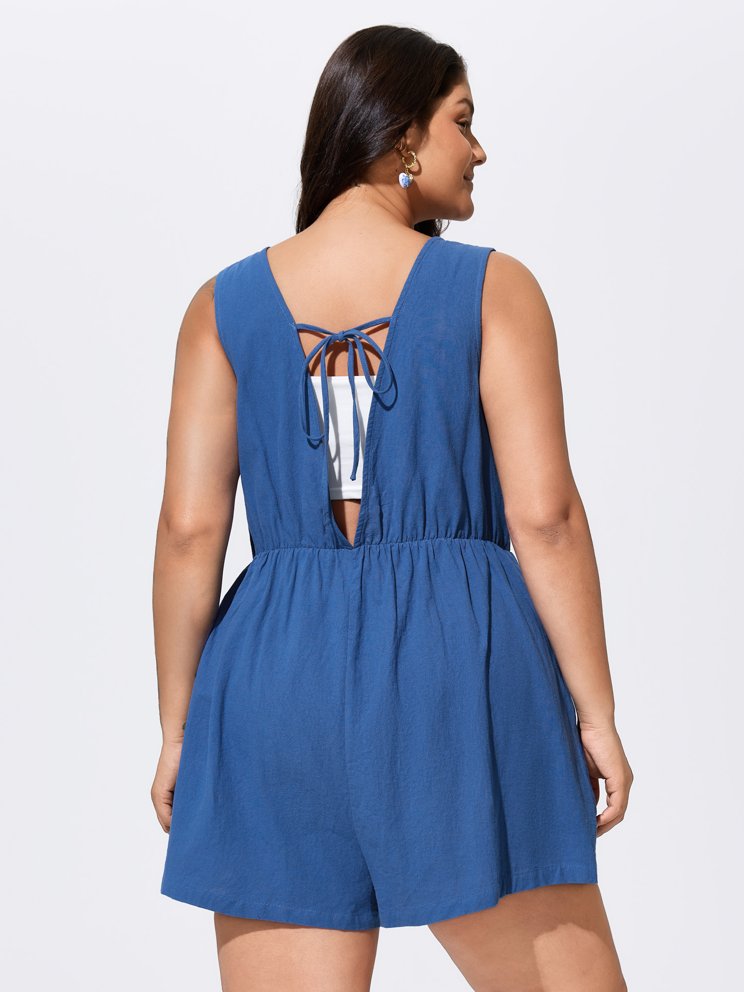 Side view of BloomChic Women's Plus Size Cotton Pleated Open Back-Ties Plain Romper Mediumblue Vacation 10/M