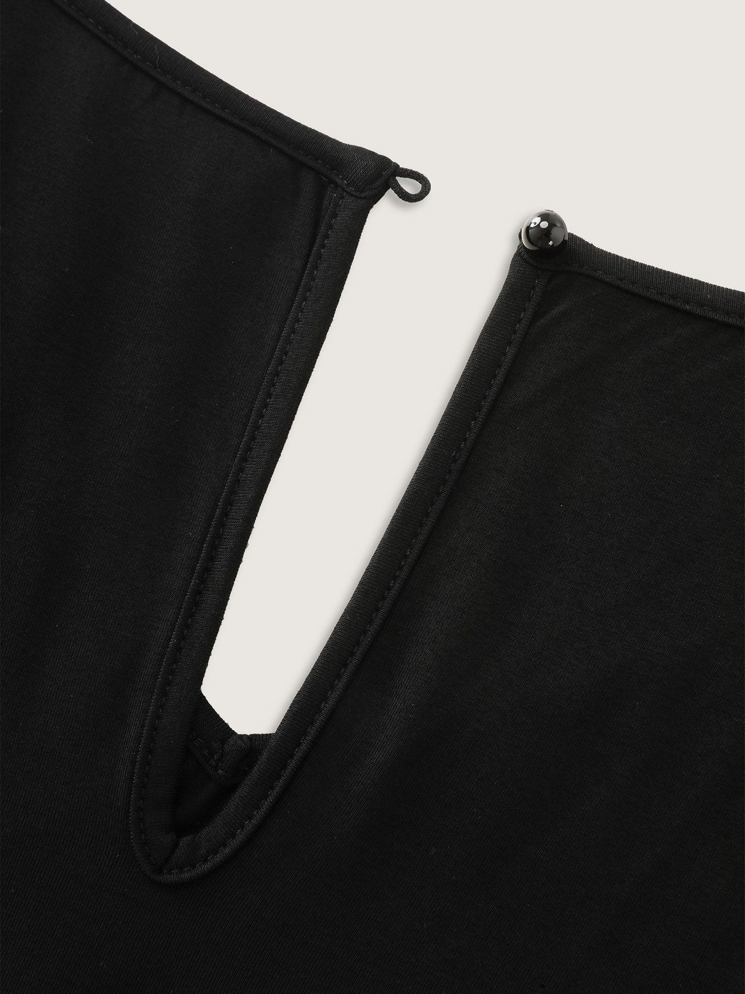 Side view of BloomChic Women's Plus Size Supersoft V-Neck Drawstring Romper Black Casual 10/M