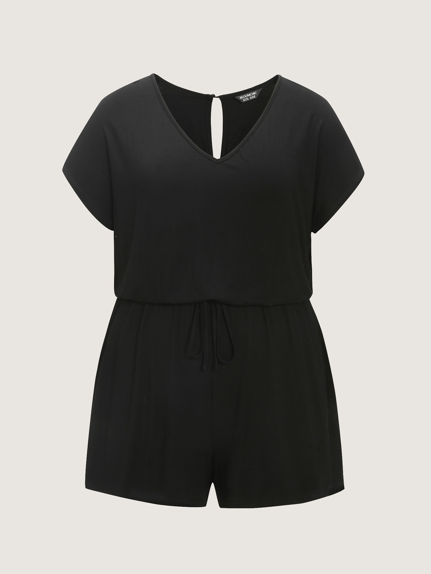 Side view of BloomChic Women's Plus Size Supersoft V-Neck Drawstring Romper Black Casual 10/M