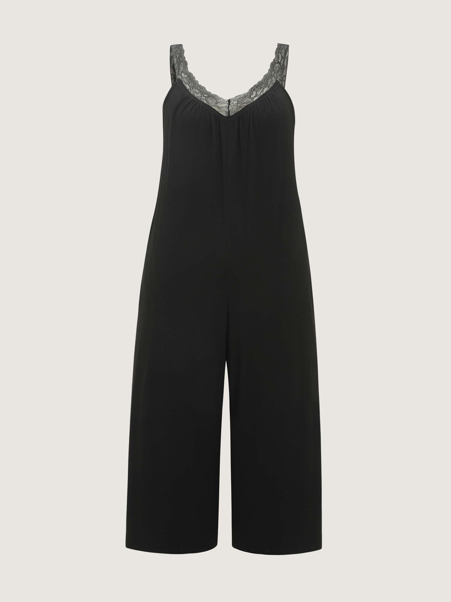 Side view of BloomChic Women's Plus Size Supersoft Stretchy Sheer Neckline Relaxed-Fit Lounge Jumpsuit Black not graphics 14-16/1X