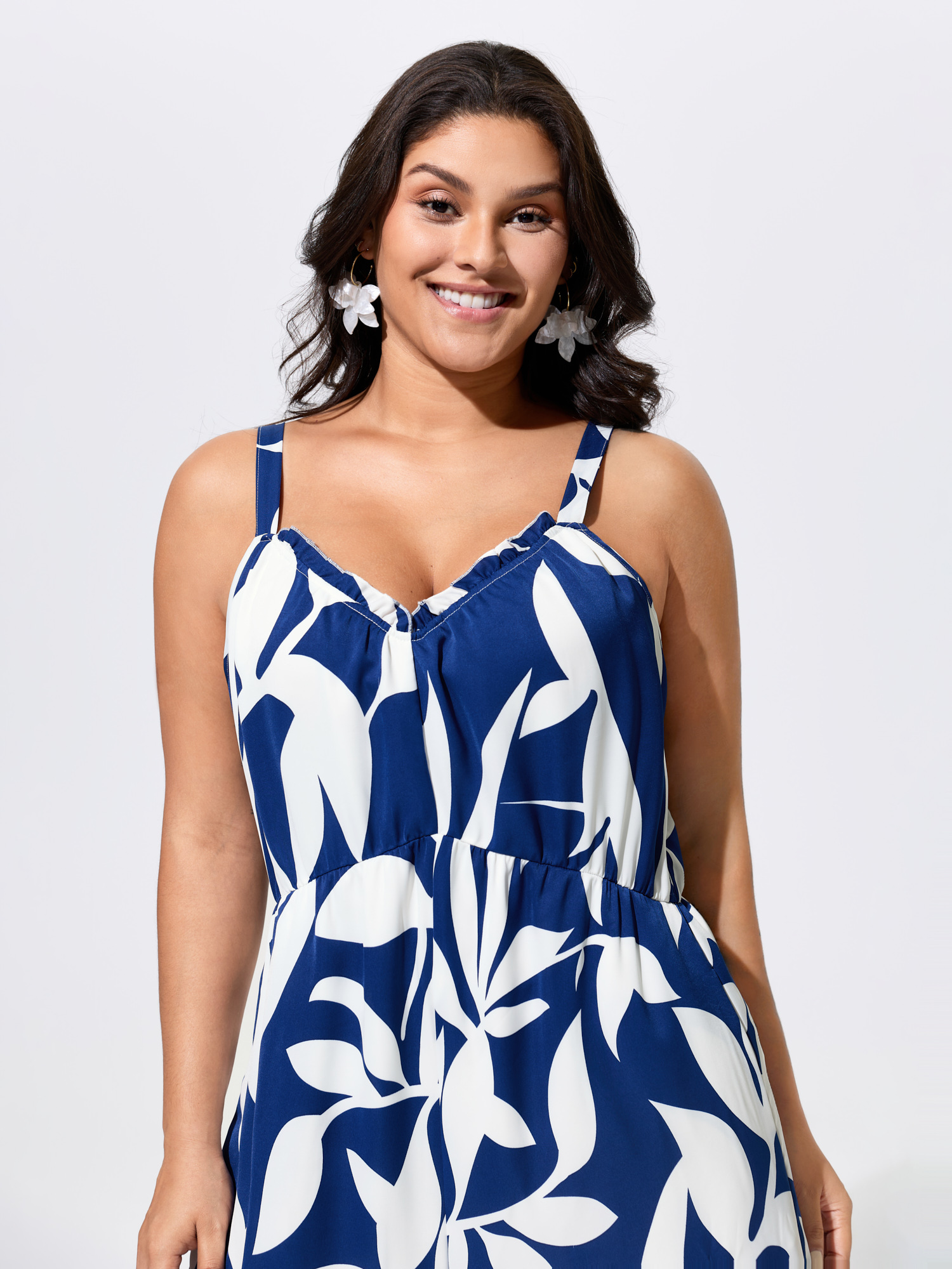 Side view of BloomChic Women's Plus Size Silhouette Floral Print Sweetheart Jumpsuit Indigo Vacation 22-24/3X